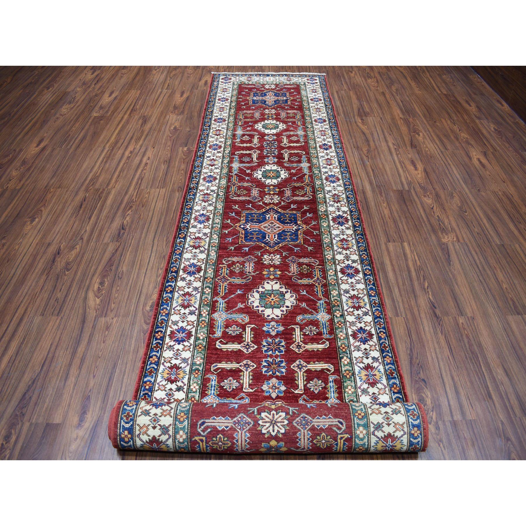 This is a truly genuine one-of-a-kind Red Super Kazak Geometric Design Hand-Knotted XL Runner Oriental Rug.It has been Knotted for months and months in the centuries-old Persian weaving craftsmanship techniques by expert