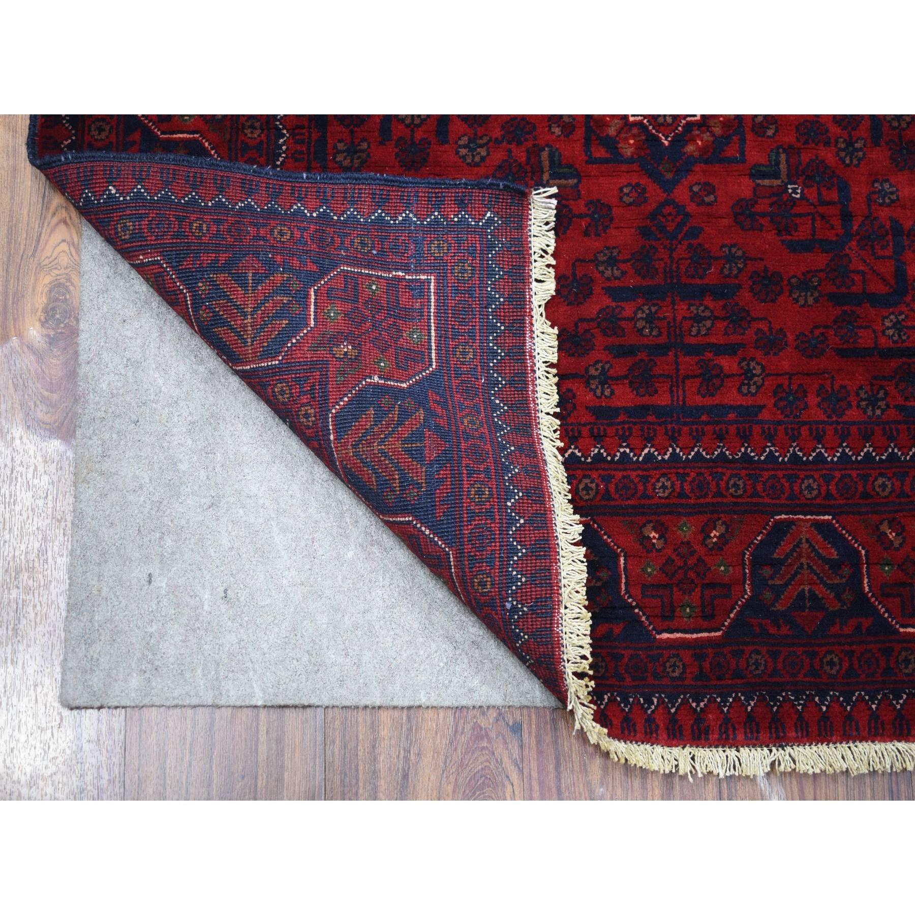 This is a truly genuine one-of-a-kind Deep and Saturated Red with Touches of Blue, Afghan Khamyab with Geometric Design, Shiny Wool Hand Knotted, Oriental Rug. It has been Knotted for months and months in the centuries-old weaving craftsmanship