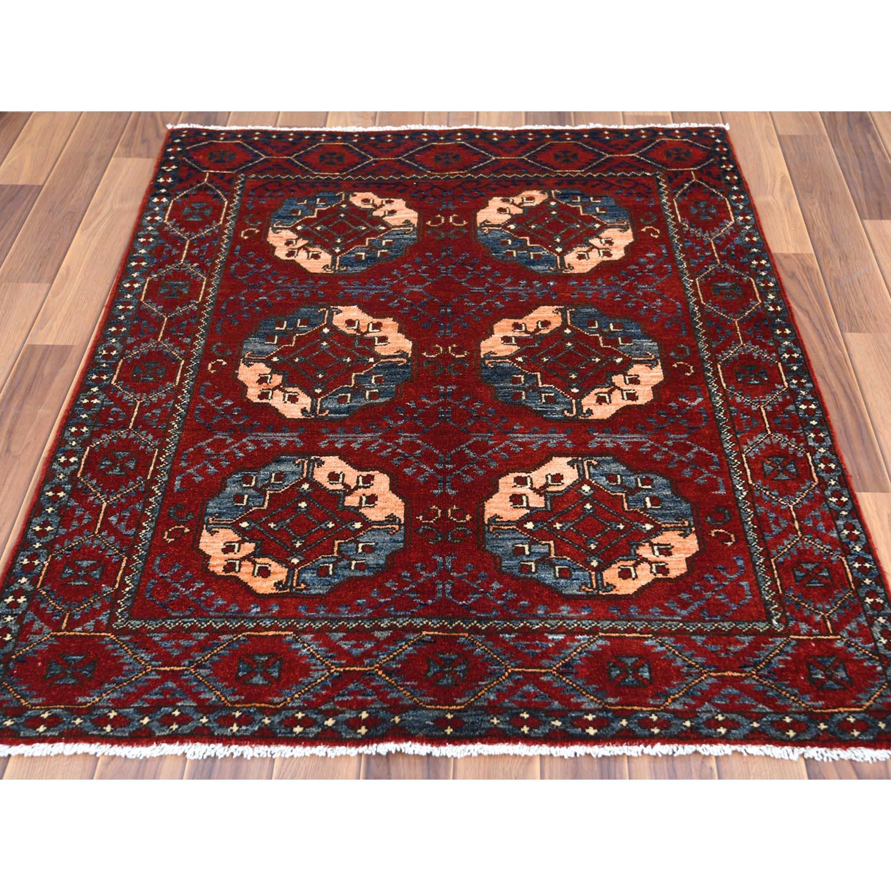 This is a truly genuine one-of-a-kind Pure Wool Copper Red Color Afghan Ersari With Elephant Feet Design Hand Knotted Oriental Rug. It has been Knotted for months and months in the centuries-old weaving craftsmanship techniques by expert