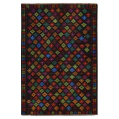 Alfombra de lana afgana baluchi de 3'5" x 5', de color negro con motivos geométricos coloridos, tejida a mano