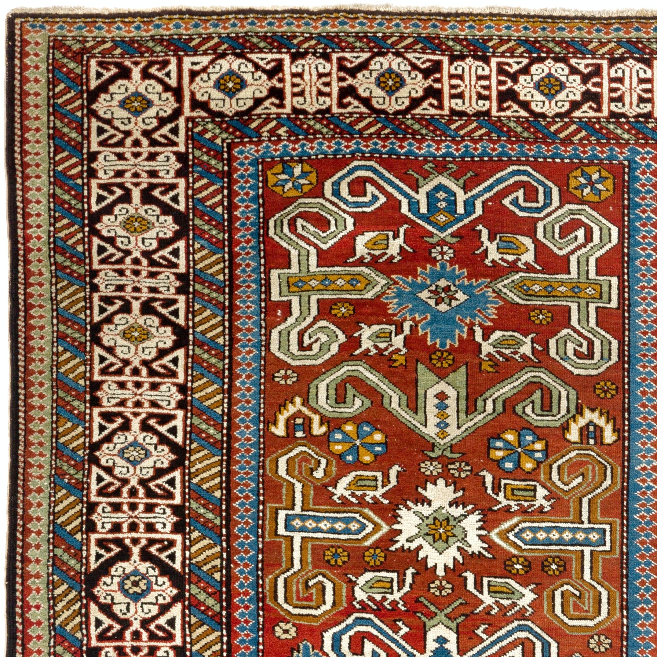 Antique North East Caucasian Perepedil rug from the region of Quba in Azerbaijan. Classic all-over rams horn design with flowers, animals and small stars framed by an elegant Kufic border and colorful minor borders.
Even medium wool pile on cotton