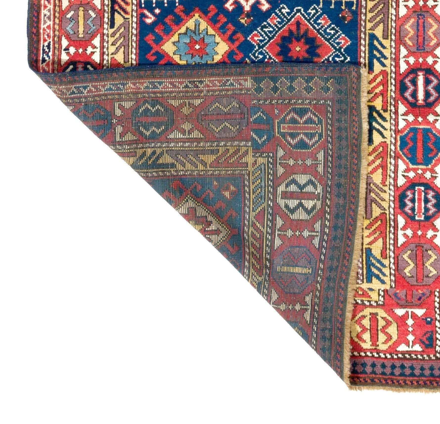 This antique Shahsavan is an expressive piece of nomadic spirit hand-knotted by the northeastern Persian tribes of the 19th century. It is made up of four connected square sections of differing sizes taking up the entire space of the field with a