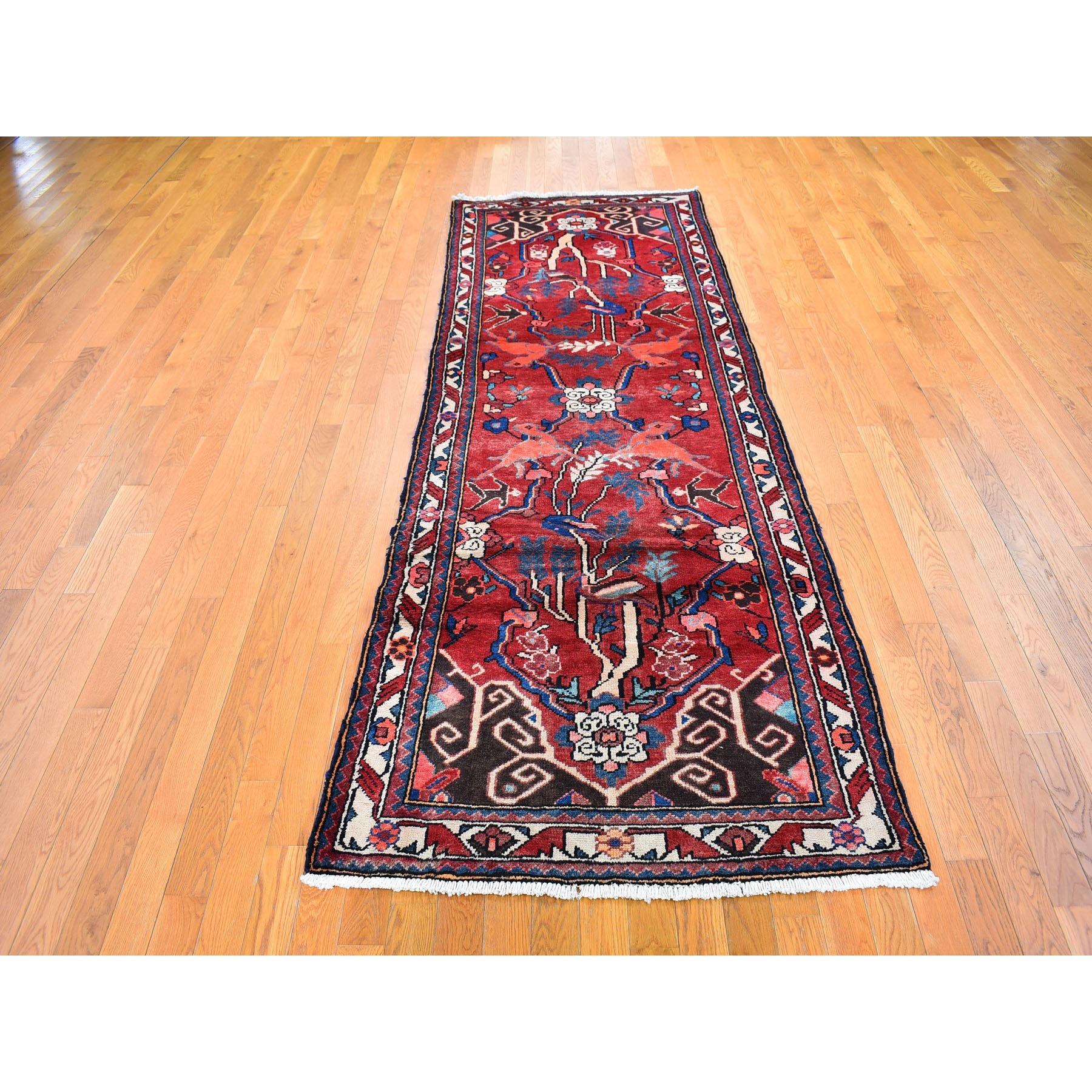 This is a truly genuine one-of-a-kind Red Natural Wool New Persian Bakhtiar with Deer Figurines Hand Knotted Runner Oriental Rug. It has been woven for months and months in the centuries-old Persian weaving craftsmanship techniques by expert