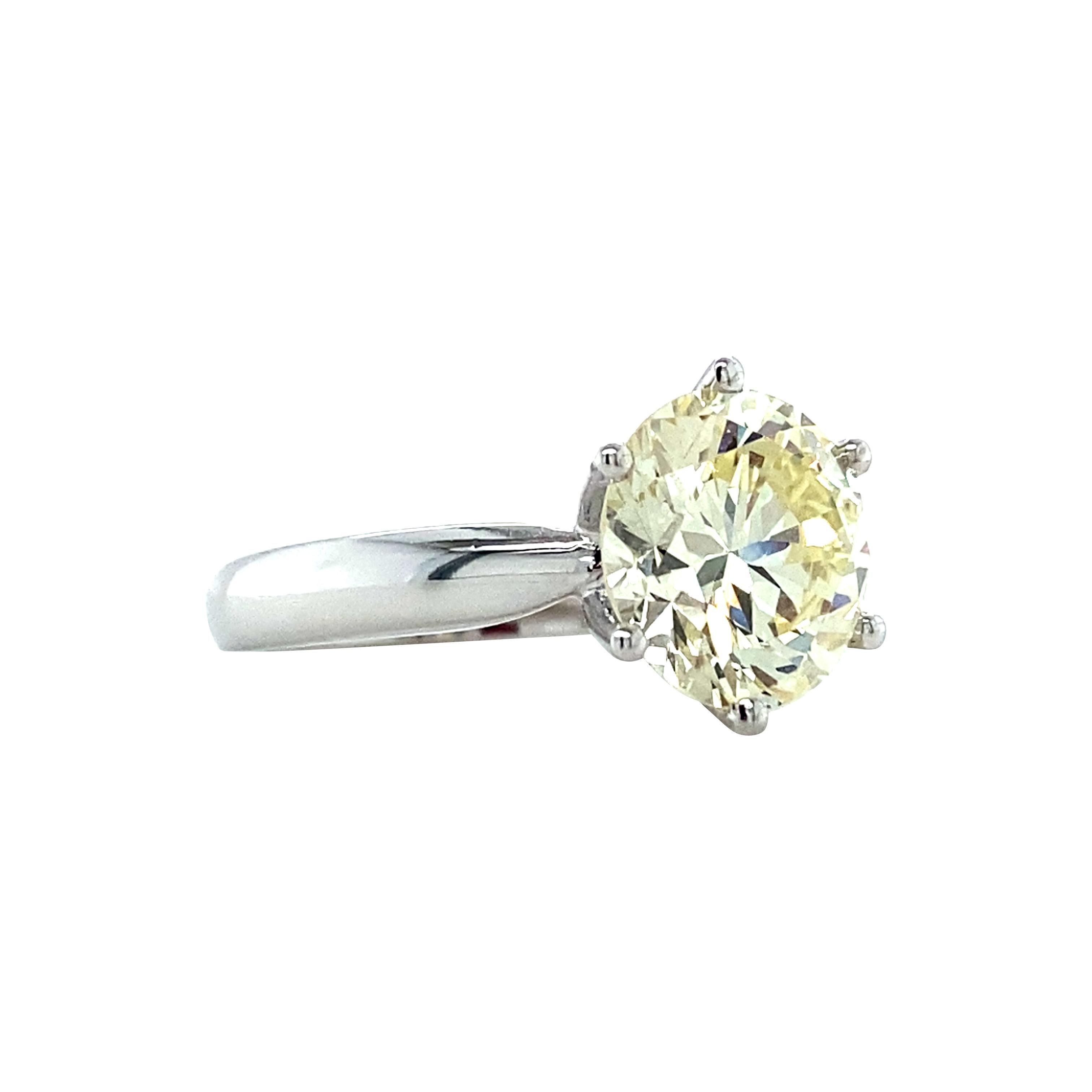 An exceptional vintage diamond weighing 3.6 carats has been set into a new 6-prong solitaire mounting and is ready to gift or wear. An exquisite engagement ring or a perfect right-hand ring, this ring is regal and sublime. A touch of warmth infuses
