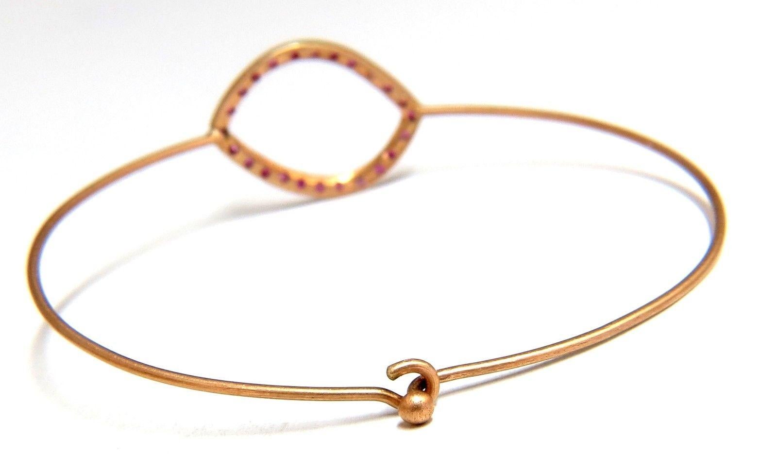 Handmade.36ct Natural Pink Sapphire Wire Bangle Bracelet

2.1 grams.

14kt. Pink gold. 

Measures 6 inches (wearable length)

15mm Wide Top Frame 