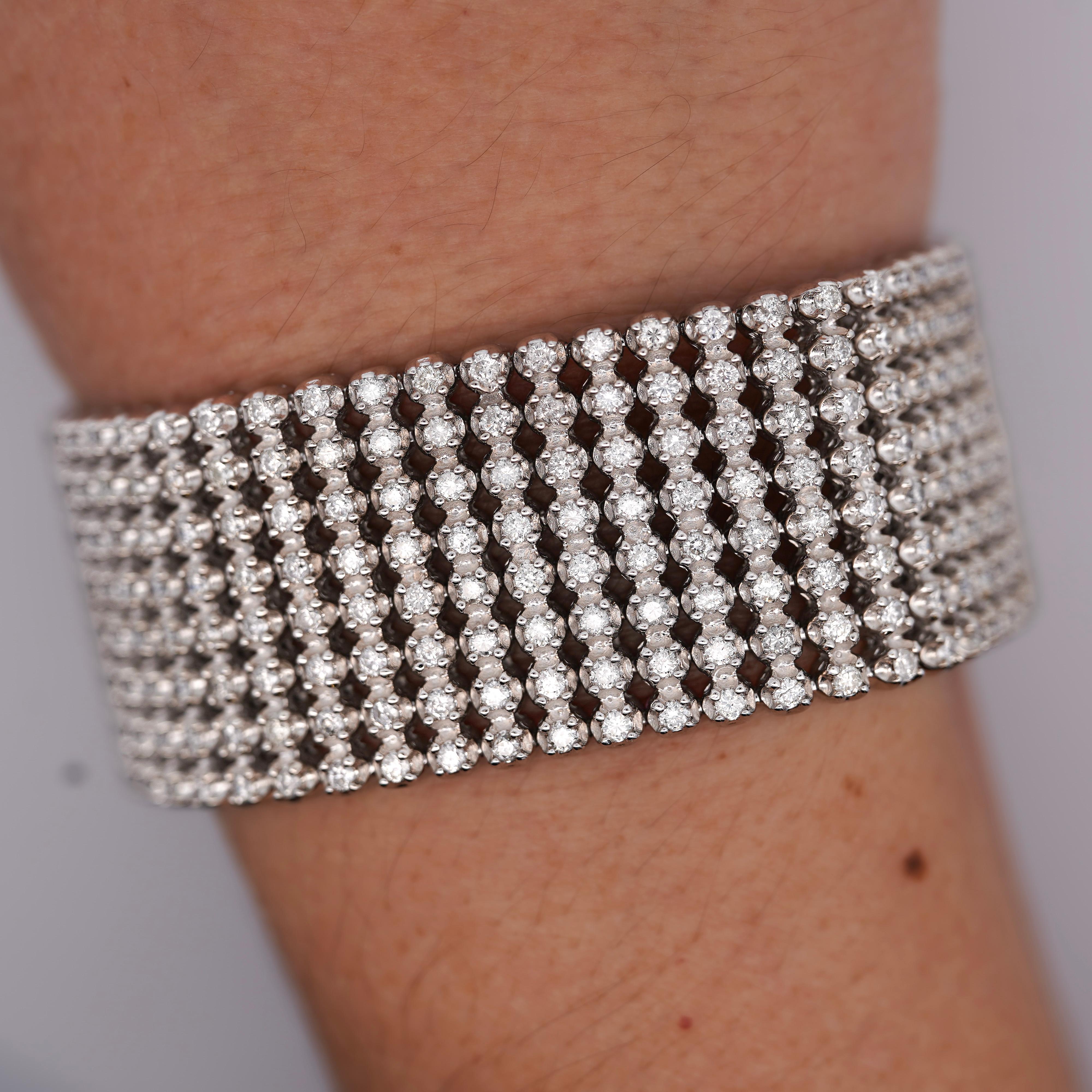 36 Carat Round Brilliant Cut 8-Row Pave Diamond 10K White Gold Multi Link Tennis Bracelet With Box Closure. 

Details:
Item Type: 8 Row Tennis Bracelet
Metal: 10K White Gold
Length: 8.25 inches
Width: 1.1 inches
Weight: 96.0 Grams
Closure: Box
