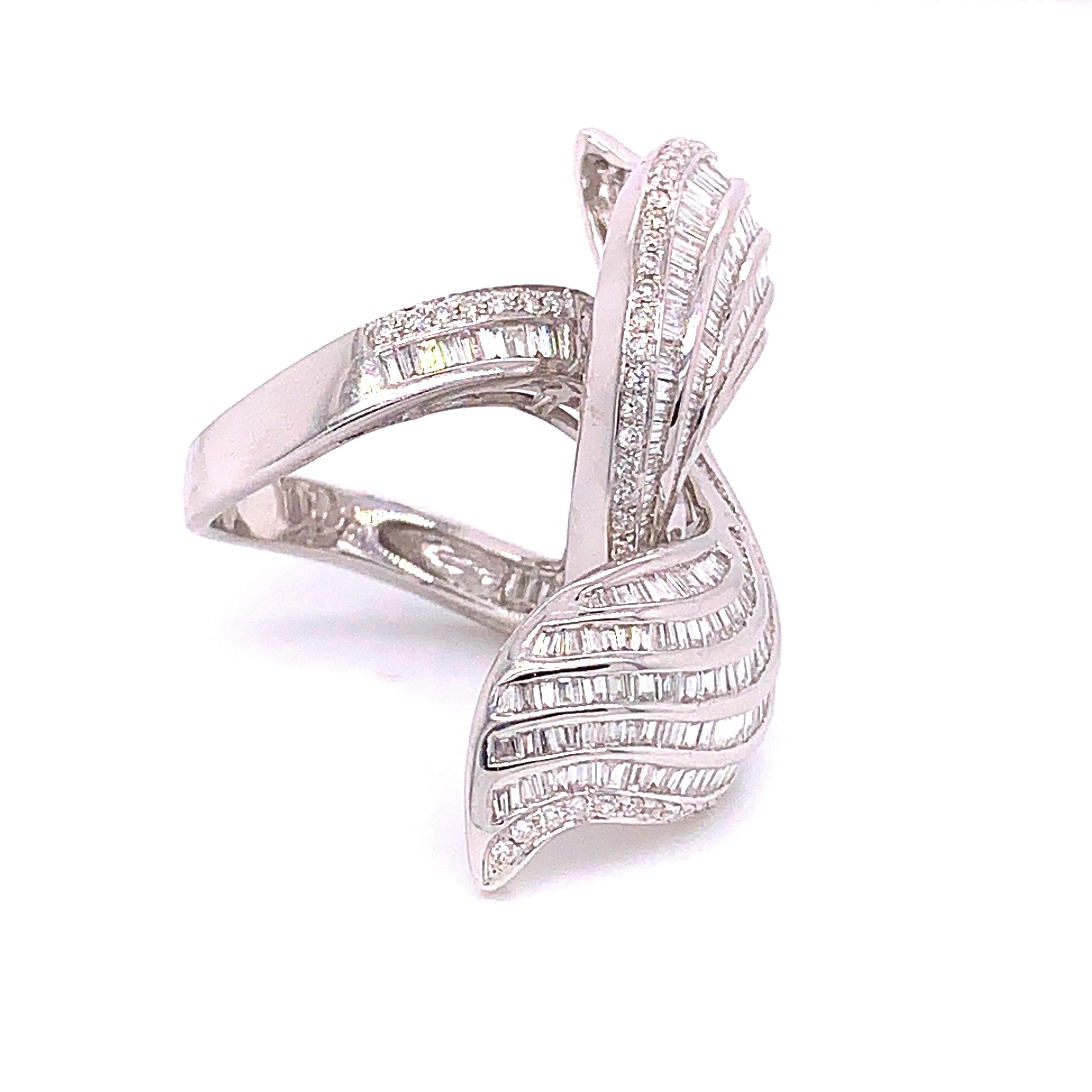 3.6 Carat Twirling Baguette Diamond Ring featuring an unusual and fascinating twirling 6 row design. Set with 333 tapered baguette cut diamonds crafted in 3.11 carats and 74 white round cut diamonds crafted in 0.49 carats.

Diamond And Gold