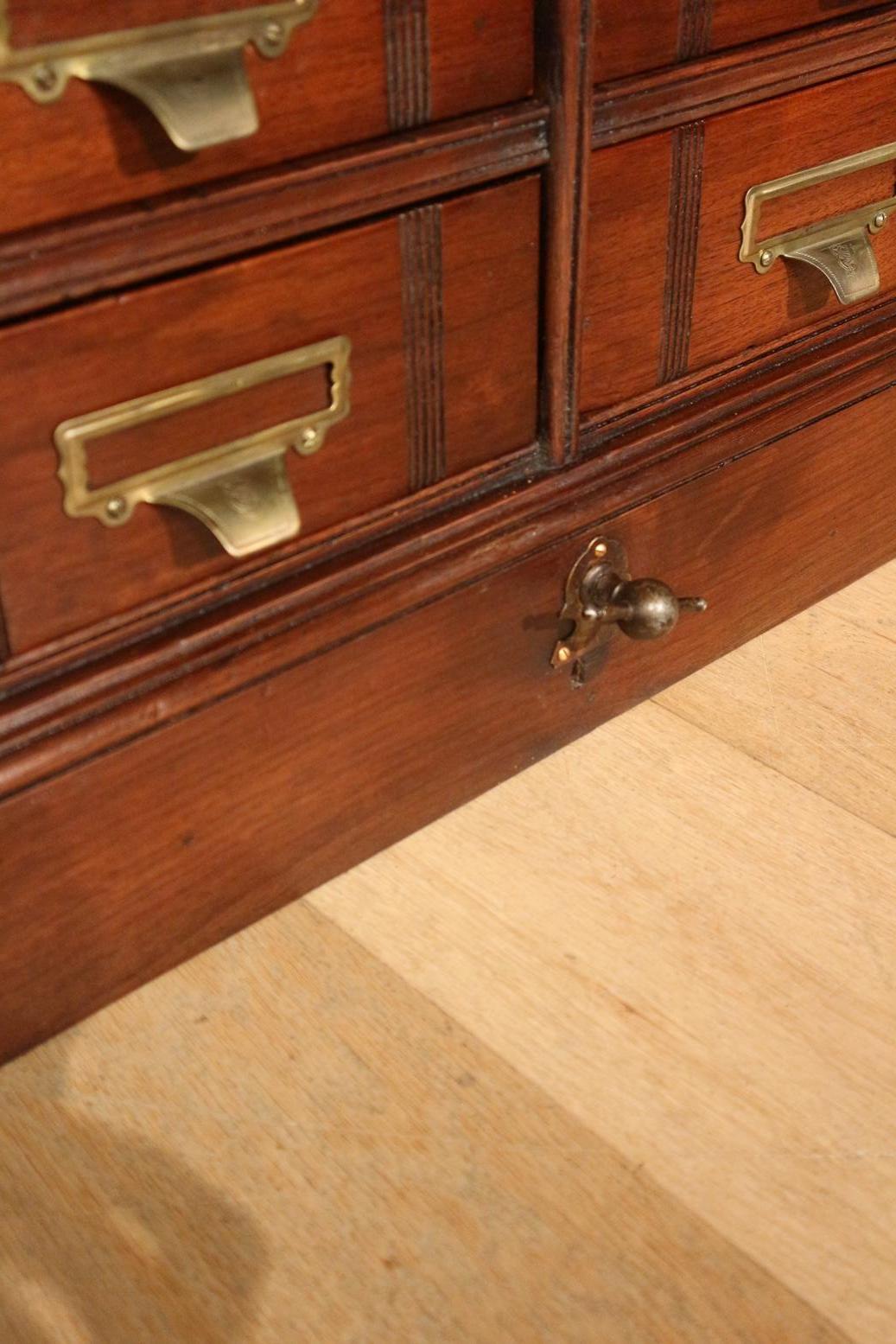 Antique walnut filing cabinet from the well-known company Shannon from the US. They also had a European branch in London. This is a filing cabinet with 36 drawers and can be locked by a central bolt (bottom center) key not present. (Not all drawers