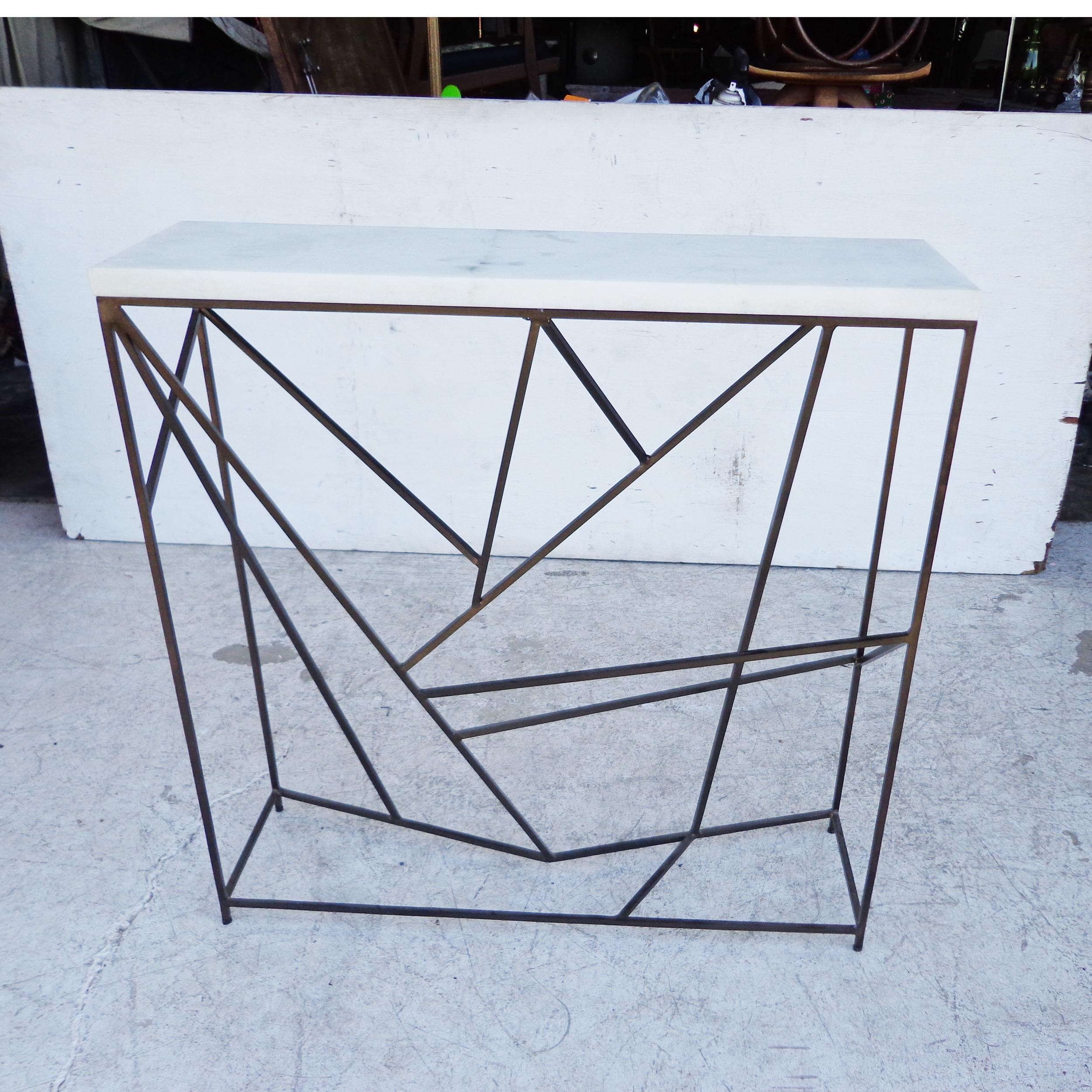 Modern Iron Marble Console
Stylish console that is perfect for entries. Made of steel in aged black with a honed white marble top.
By Uttermost.
Dimensions:
36 W x 37 H x 10 D 
 Very Good Condition.