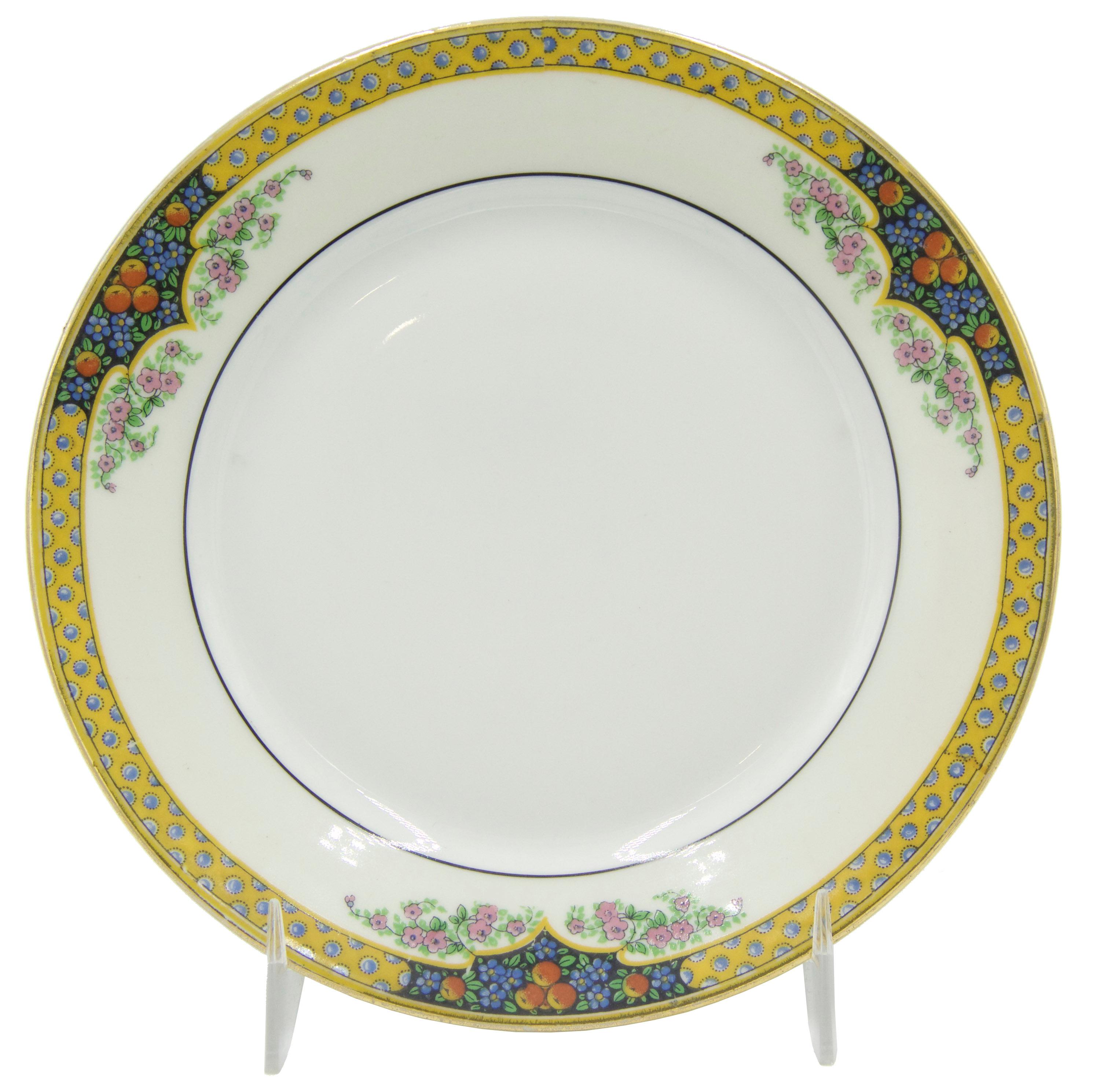 Service de table de 36 pièces en porcelaine de Limoges de l'époque victorienne avec bordure jaune et garniture florale (PRIX DU SET).
 