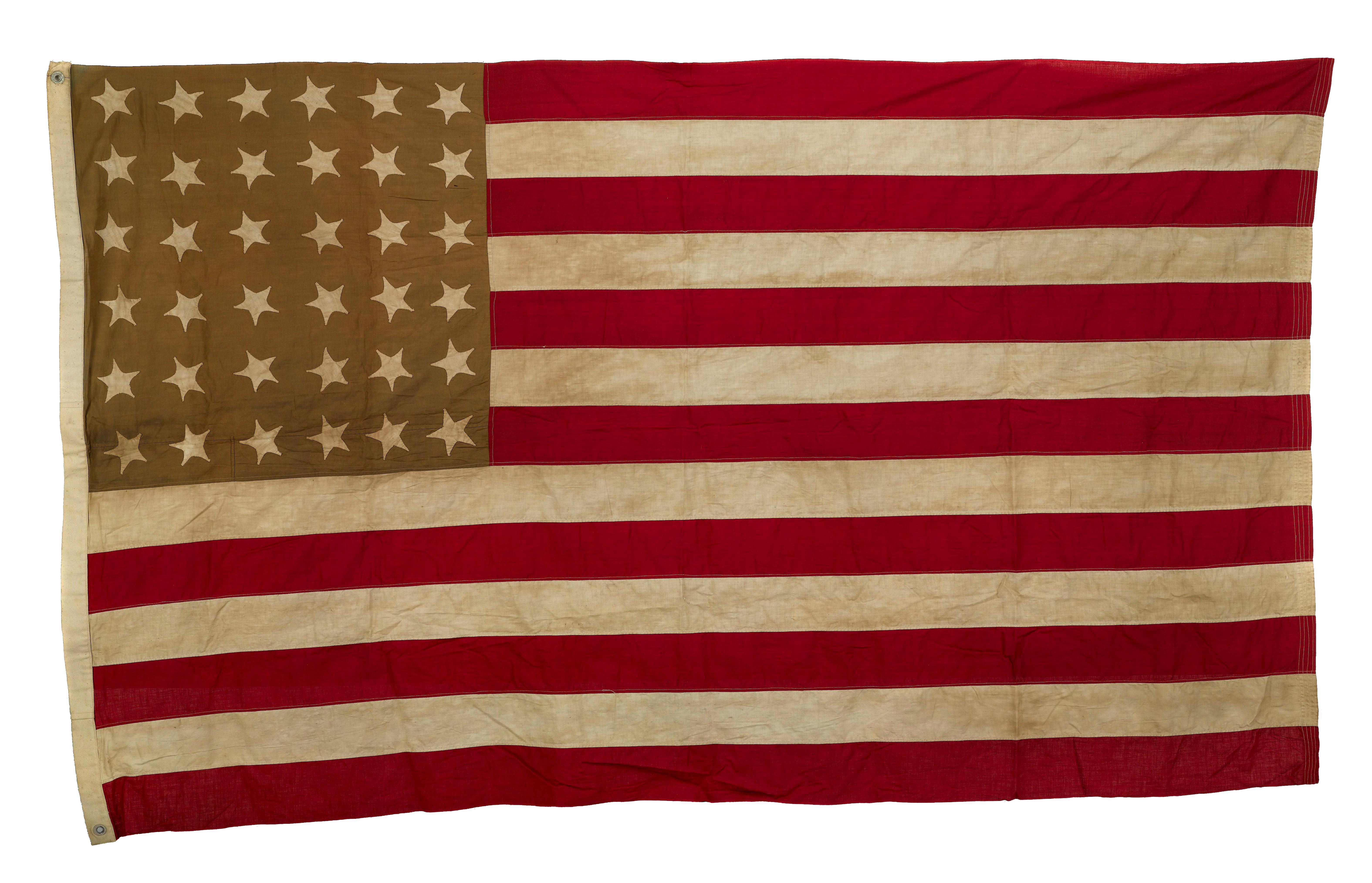 This is a 36-star hand-sewn antique flag, as striking as it is scarce. 36 stars celebrate the addition of Nevada to the Union and officially flew from July 4, 1865 to July 3, 1867, under President Andrew Johnson. This large flag has an impressive