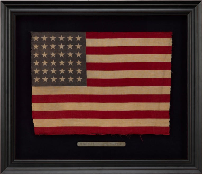This is a 36-star antique flag, as striking as it is scarce. 36 stars celebrate the addition of Nevada to the Union and officially flew from July 4, 1865 to July 3, 1867, under President Andrew Johnson. The 36 stars are printed in a standard row