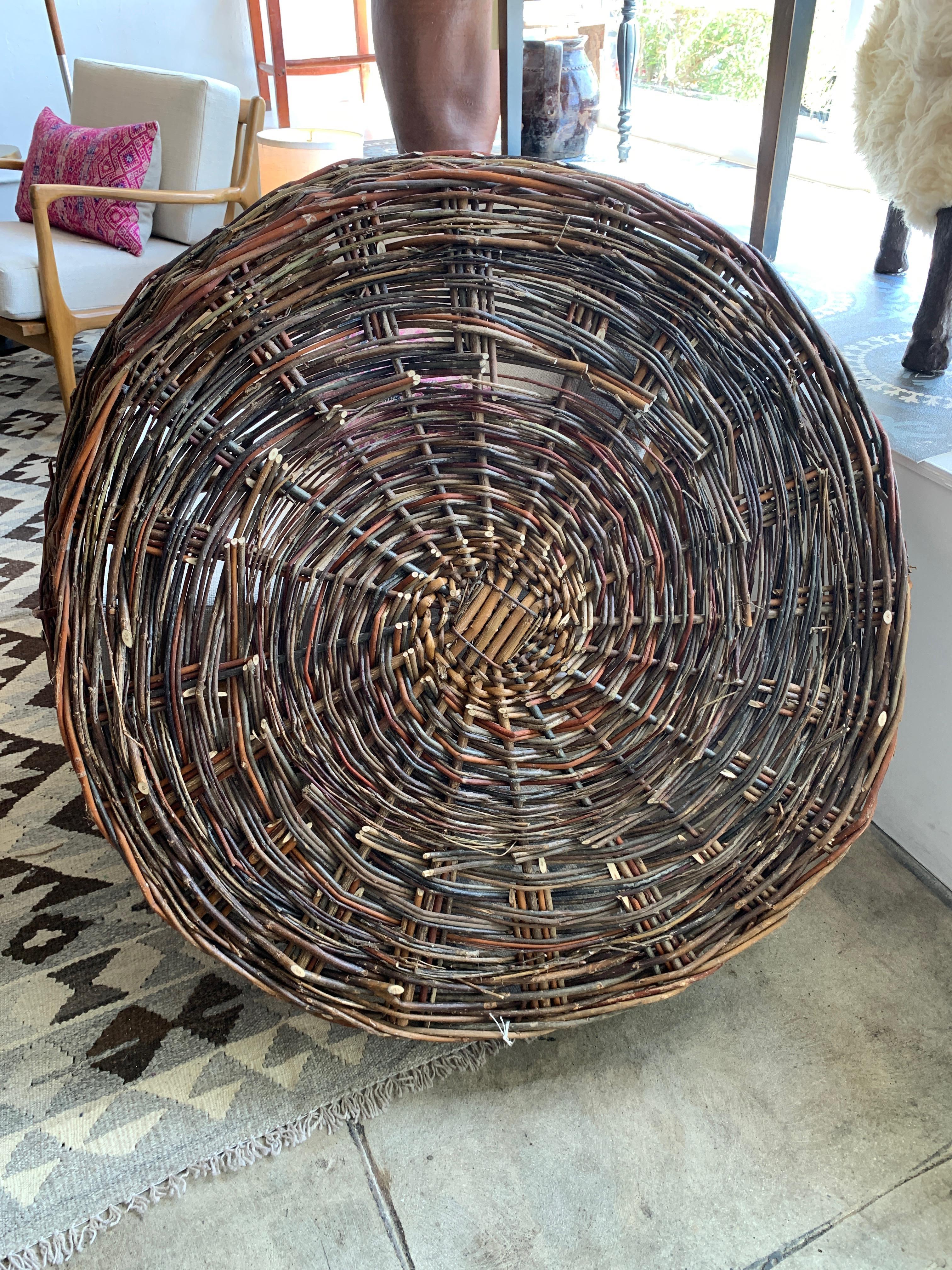 Large, flat-woven basket from Europe. Makes a wonderful wall decoration but could also be used to collect homegrown fruits and vegetables for easy harvesting. Measures: 36