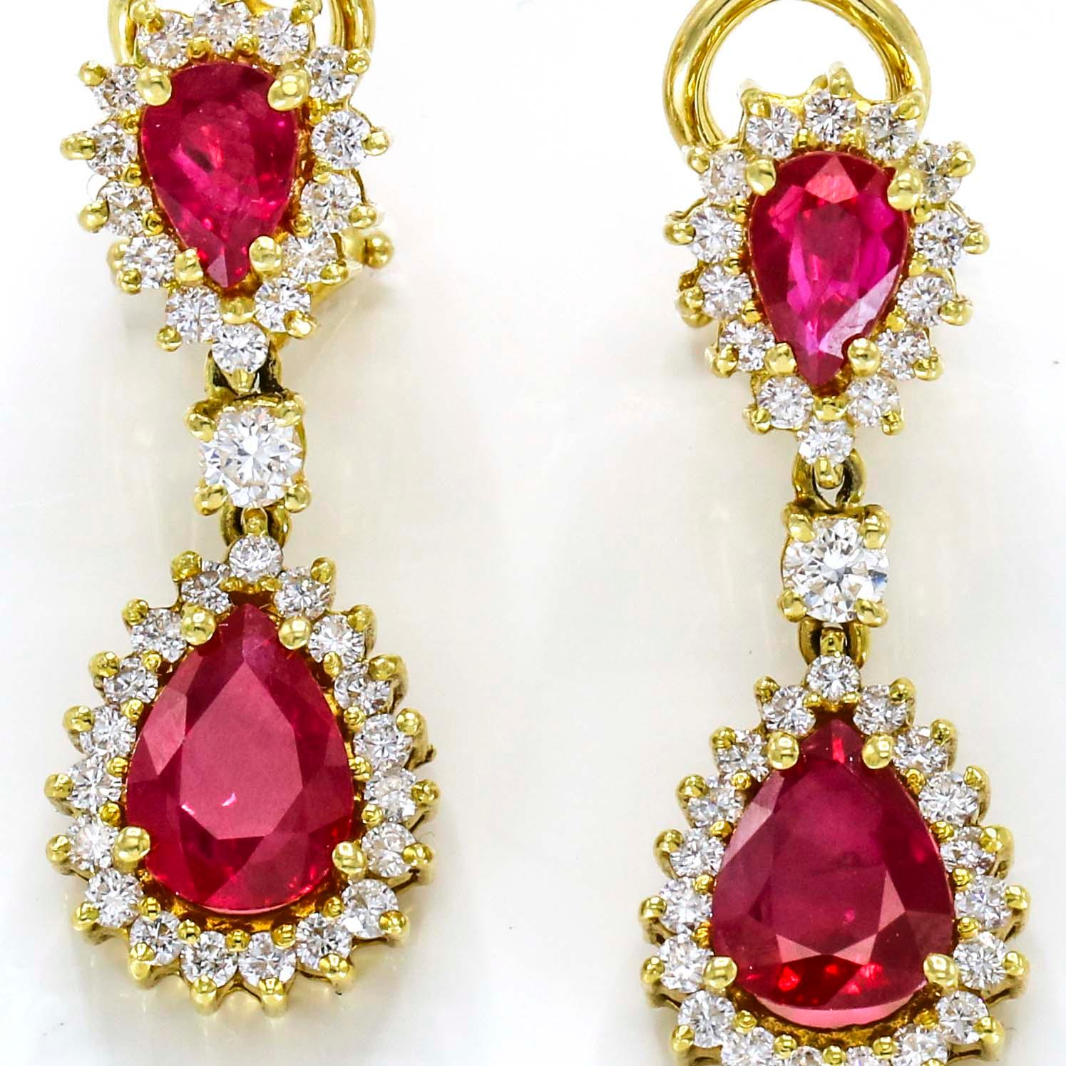Burma ruby and diamond dangle clip-on earrings in 18-karat yellow gold. 

Length, 28mm
Width, 10mm
Depth, 4.5mm
Weight, 8.5 grams
Diamond Total Carat Weight, .80 carats 

Previously owned, in excellent condition. The earrings come with a gift box.