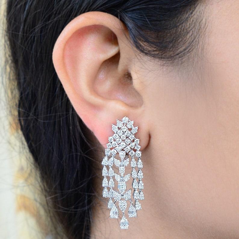 Cast from 14-karat gold, these stunning earrings are hand set with 3.60 carats of sparkling diamonds. Available in Rose, white and yellow gold.

FOLLOW MEGHNA JEWELS storefront to view the latest collection & exclusive pieces. Meghna Jewels is