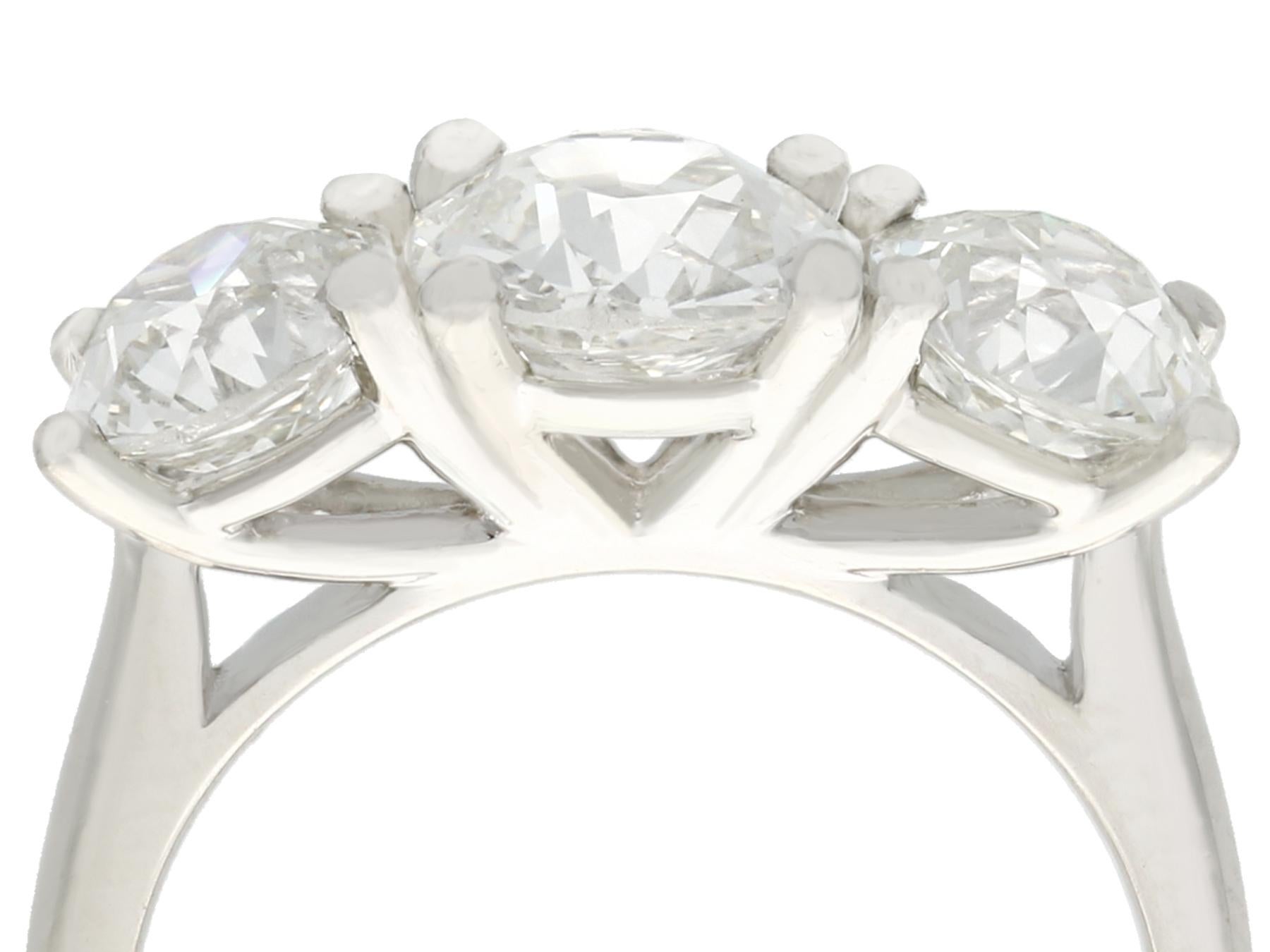 A stunning GIA certified antique 3.60 carat diamond and platinum three stone dress ring; part of our diverse antique jewellery and estate jewelry collections.

This stunning, fine and impressive diamond three stone ring has been crafted in