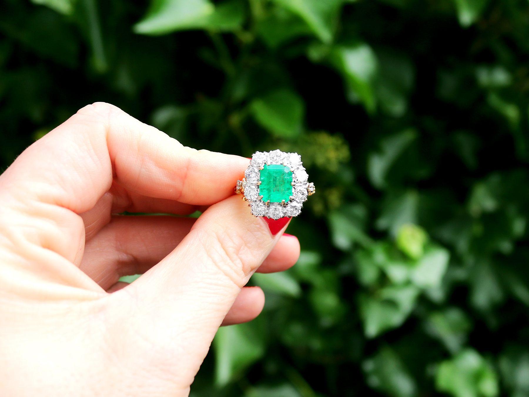 A stunning, fine and impressive vintage 3.60 carat GCS verified Zambian emerald and 1.85 carat diamond, 18 karat yellow gold, 18 karat white gold set cluster ring; an addition to our vintage jewelry and estate jewelry collections

This stunning,