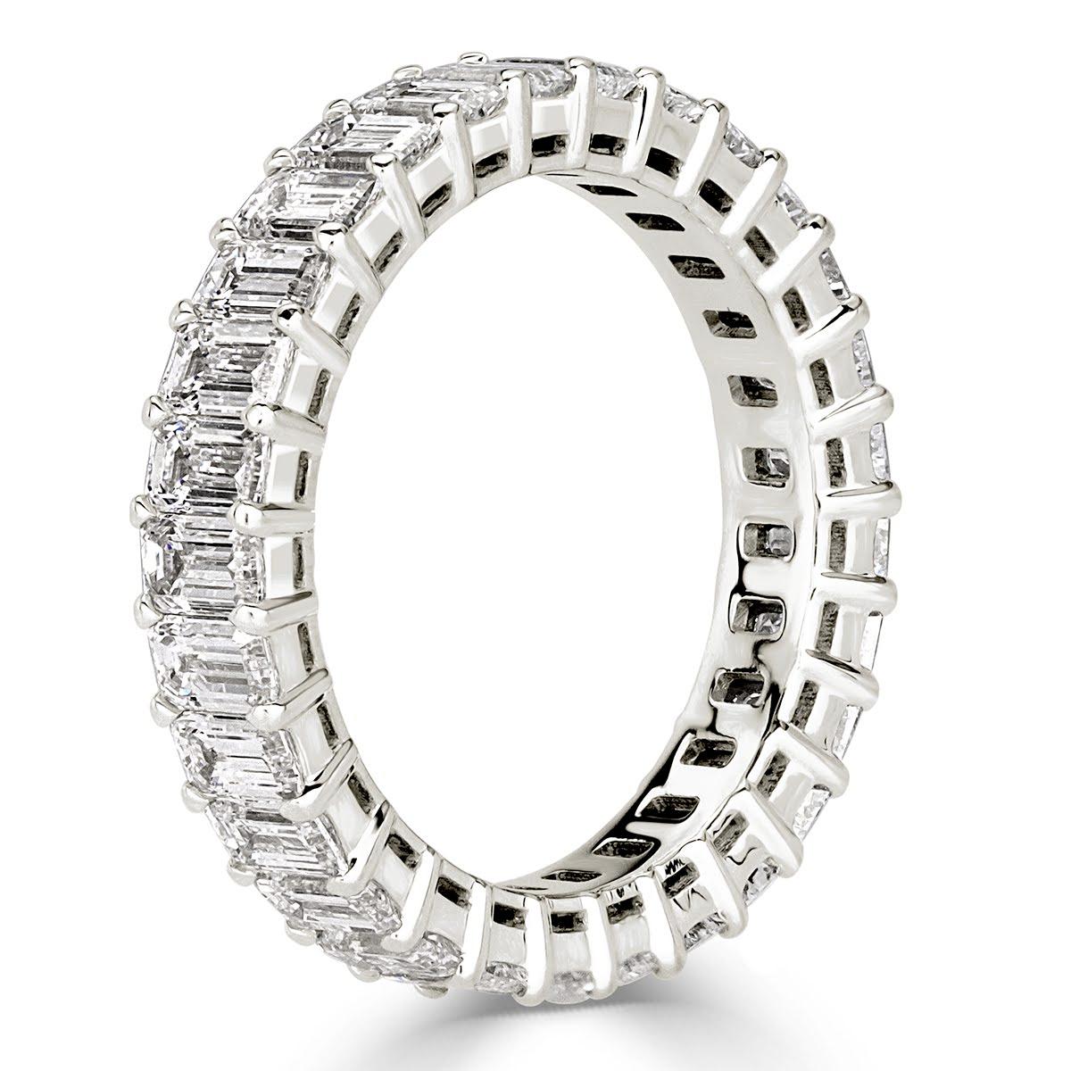 Custom created in 18k white  gold, this stunning emerald cut diamond eternity band showcases 3.60ct of perfectly matched emerald cut diamonds graded at E-F colors, VVS2-VS1 clarities. All eternity bands are shown in a size 6.5. We custom craft each