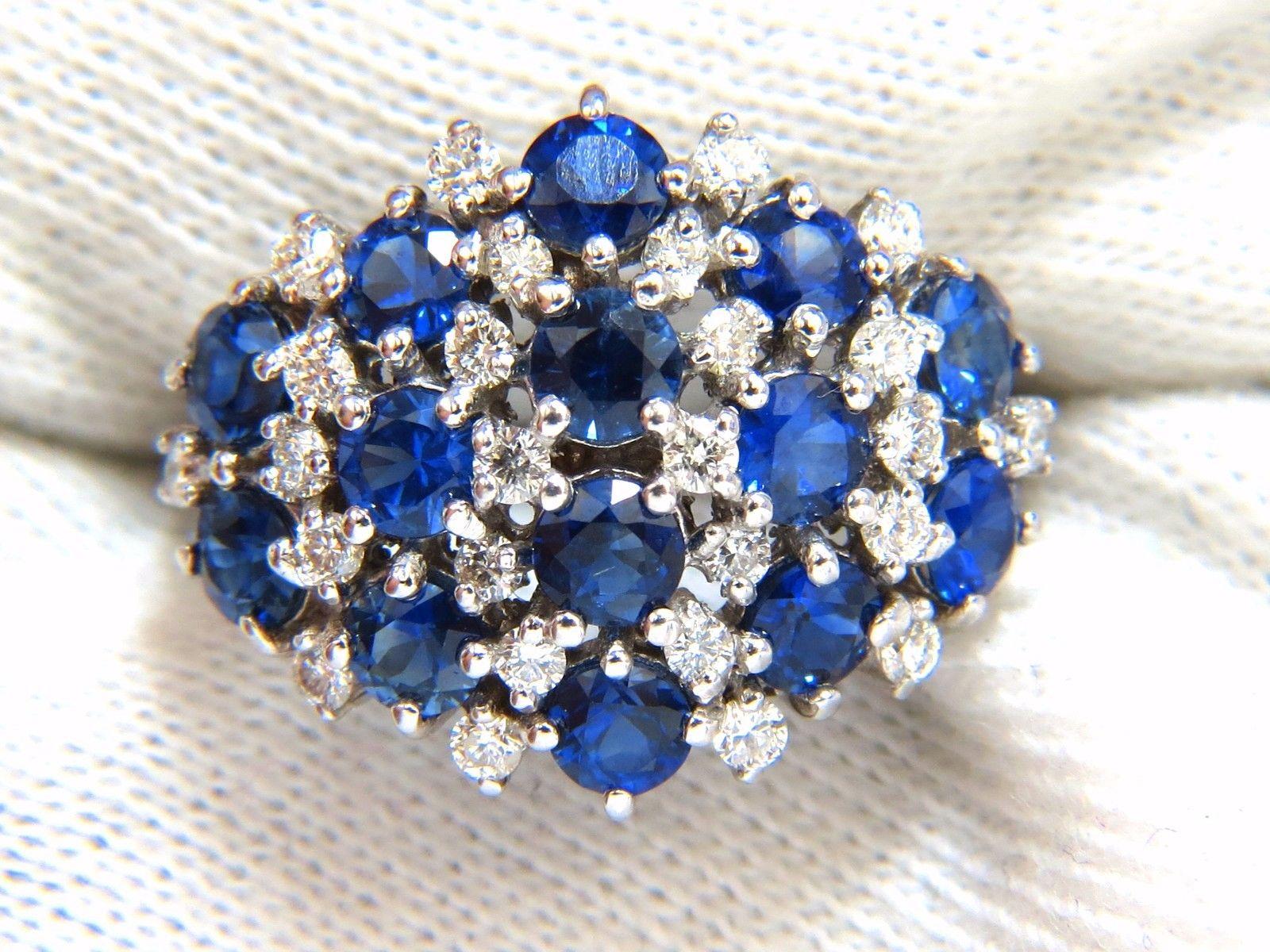 Modern Classic cocktail, raised dome ring

3.00ct. Natural Sapphires
Vivid gorgeous Royal blue hue

top gem clear clarity

full cut rounds.



Natural Round Diamonds:

.60ct.

G-color, Vs-2 clarity 

14kt. white gold

ring is 17.00mm wide 


5.4