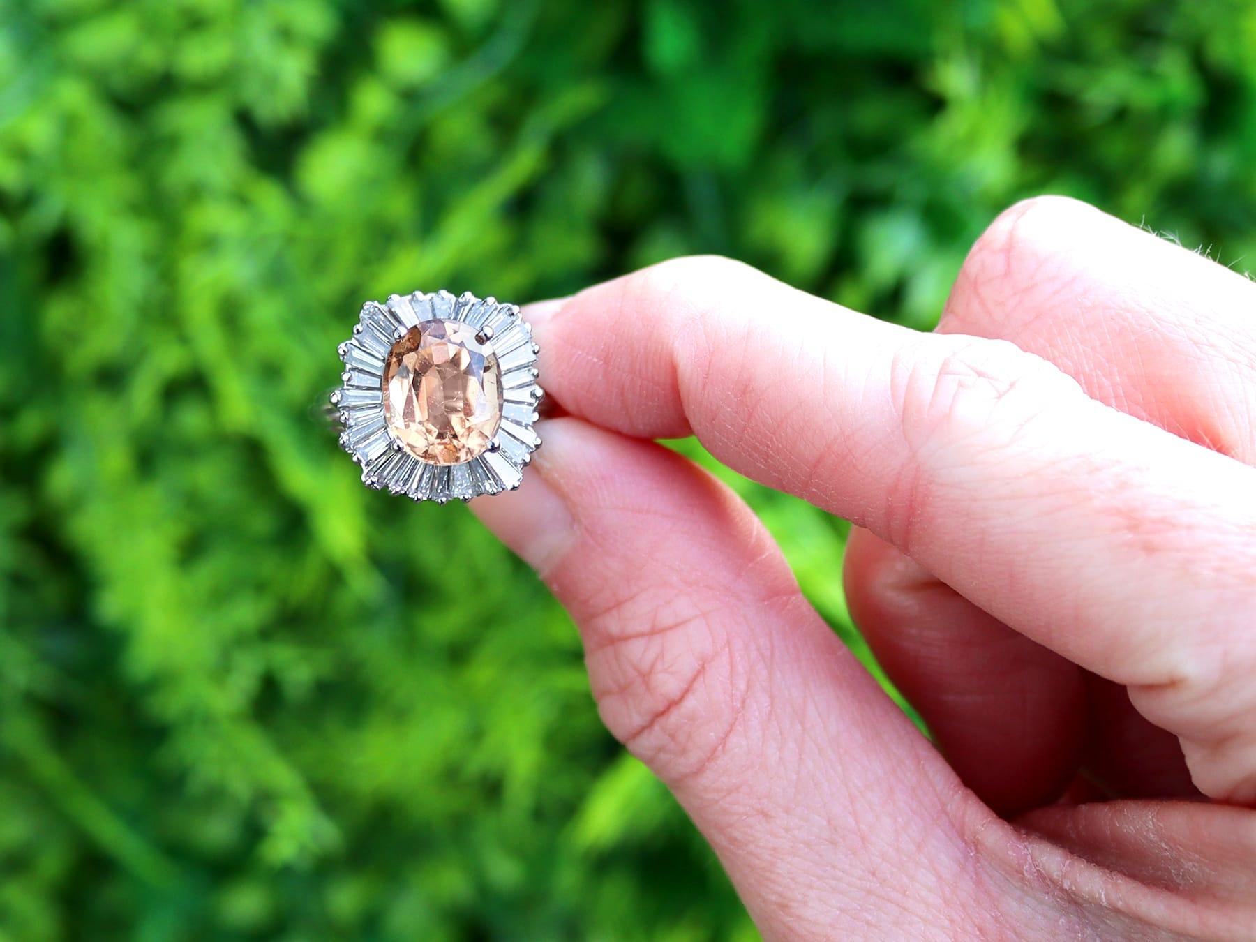 A stunning, fine and impressive vintage 3.60 carat orange tourmaline and 2.30 carat diamond, 18 karat white gold ballerina cluster ring; part of our diverse vintage tourmaline jewelry collection.

This stunning, fine and impressive vintage ring has