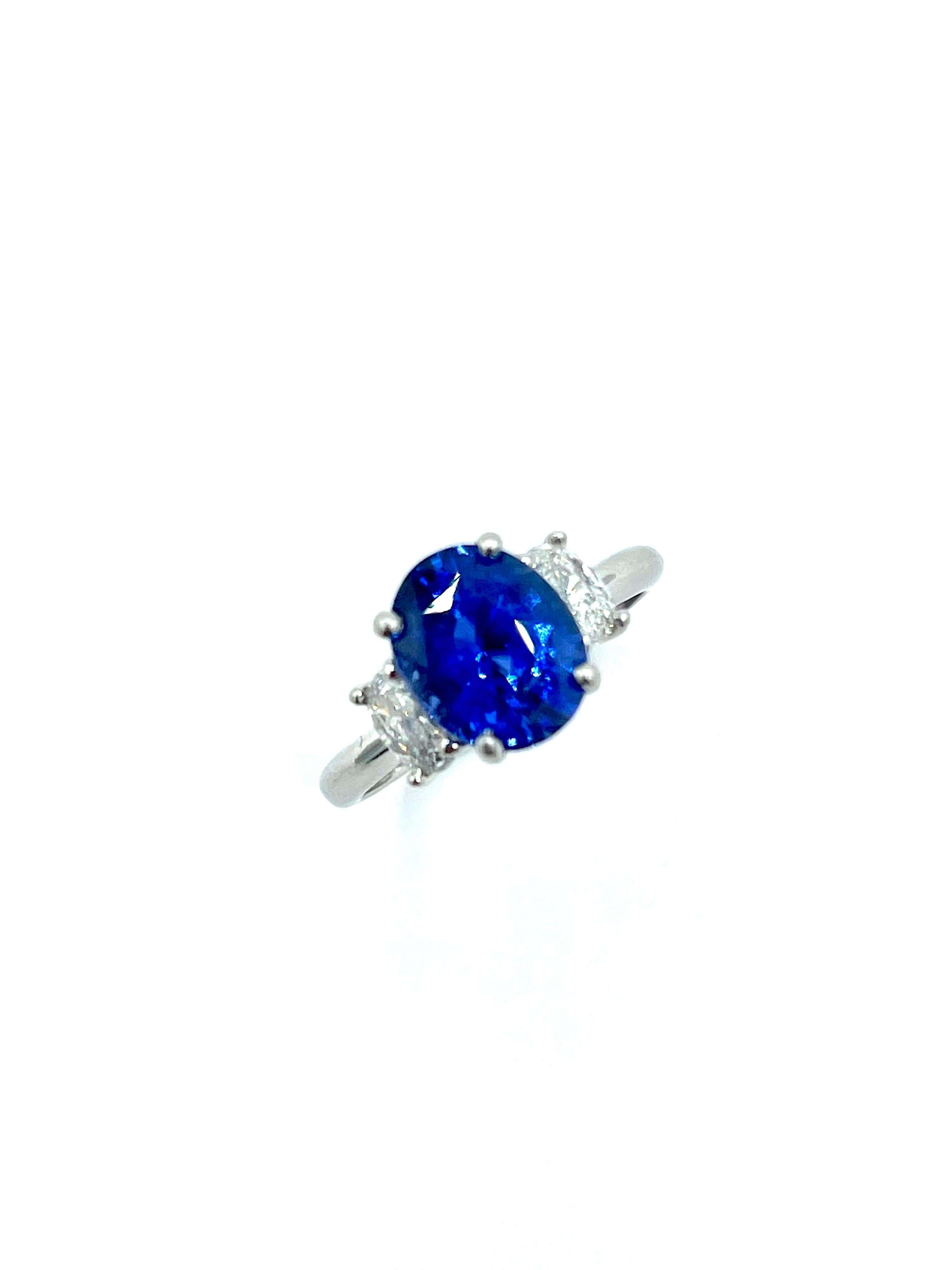 Simple and beautiful!  This ring will get lots of wear.  the 3.60 carat Sapphire is set with four prongs an a platinum basket setting with a single oval brilliant Diamond on each side.  The Sapphire displays amazing color and brilliance.  The two