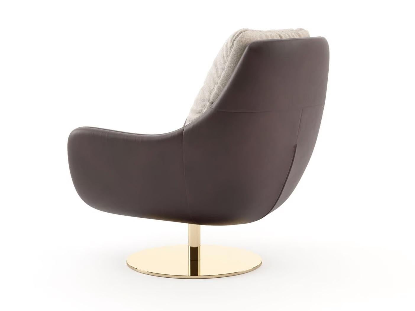 Designed by the renowned Sotiris Lazou Design Studio, this stylish armchair is an exquisite and chic seating option that merges comfort with contemporary style. It showcases a gracefully curved design and can be paired with a matching ottoman, both