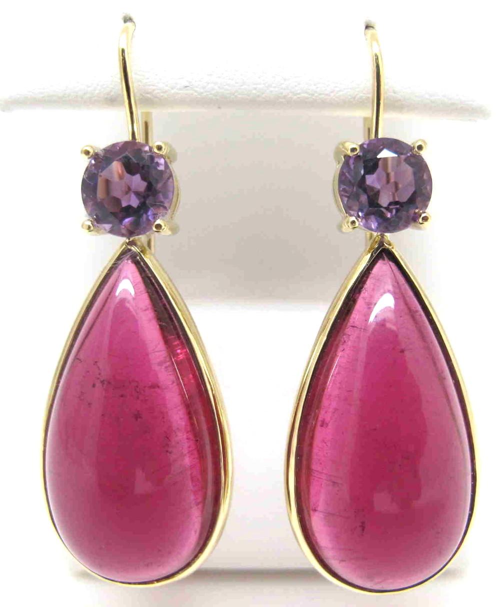 Matched pairs of cabochons of this size, color and clarity are seldom seen! Two giant (25x13mm/36.00 carats total), super fine quality rubellite tourmaline cabochons are featured in these earrings. They are a mouthwatering deep raspberry color that