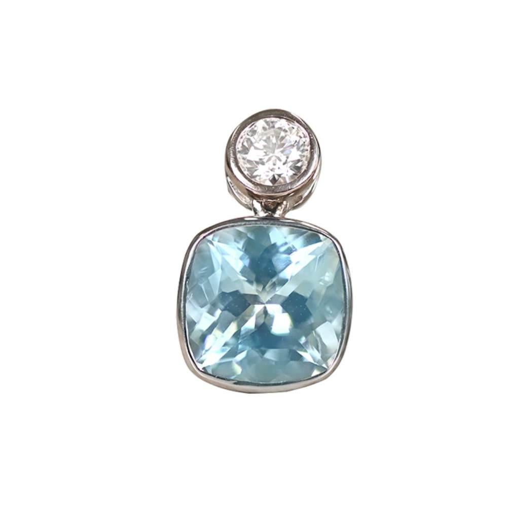 Add a touch of ethereal beauty to your ensemble with these exquisite drop earrings crafted in 18k white gold. Each earring showcases a mesmerizing cushion cut aquamarine, with a combined weight of approximately 3.60 carats, radiating a serene and