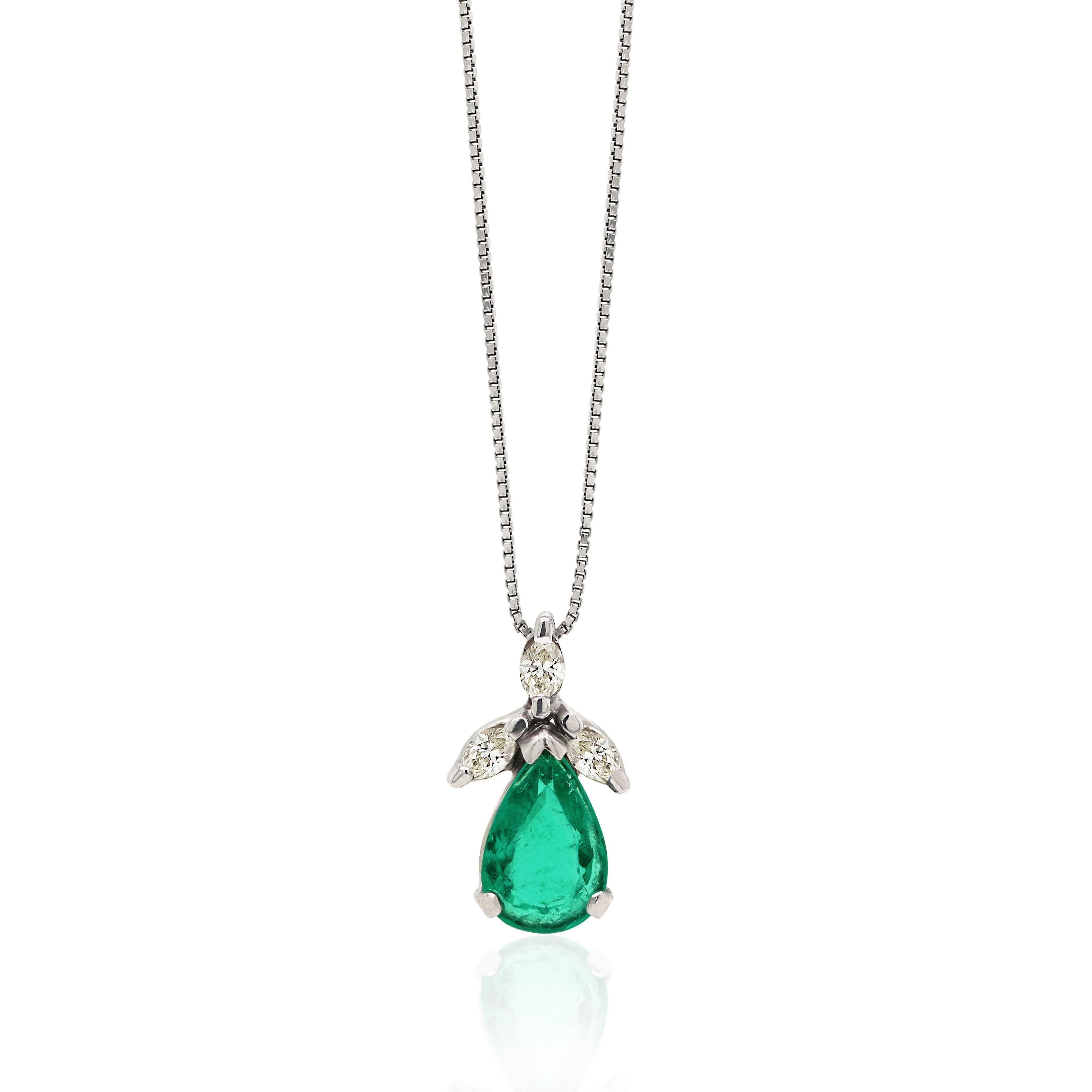 This pendant features a pear shape emerald weighing 3.60ct set in a three claw, open back mount. The beautiful emerald is accompanied by 3 marquise shape diamonds above the stone weighing a total combined weight of 0.50ct in open back, claw settings