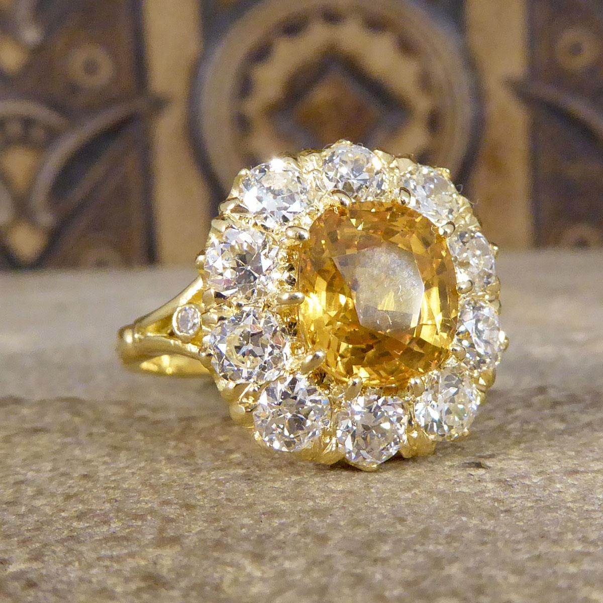 This beautiful ring features a yellow Sapphire weighing 3.60ct held securely into place with a ten claw gold setting. This yellow Sapphire is surrounded by 10 Old European cut Diamonds weighing 2.10ct in total, with two small diamonds on each