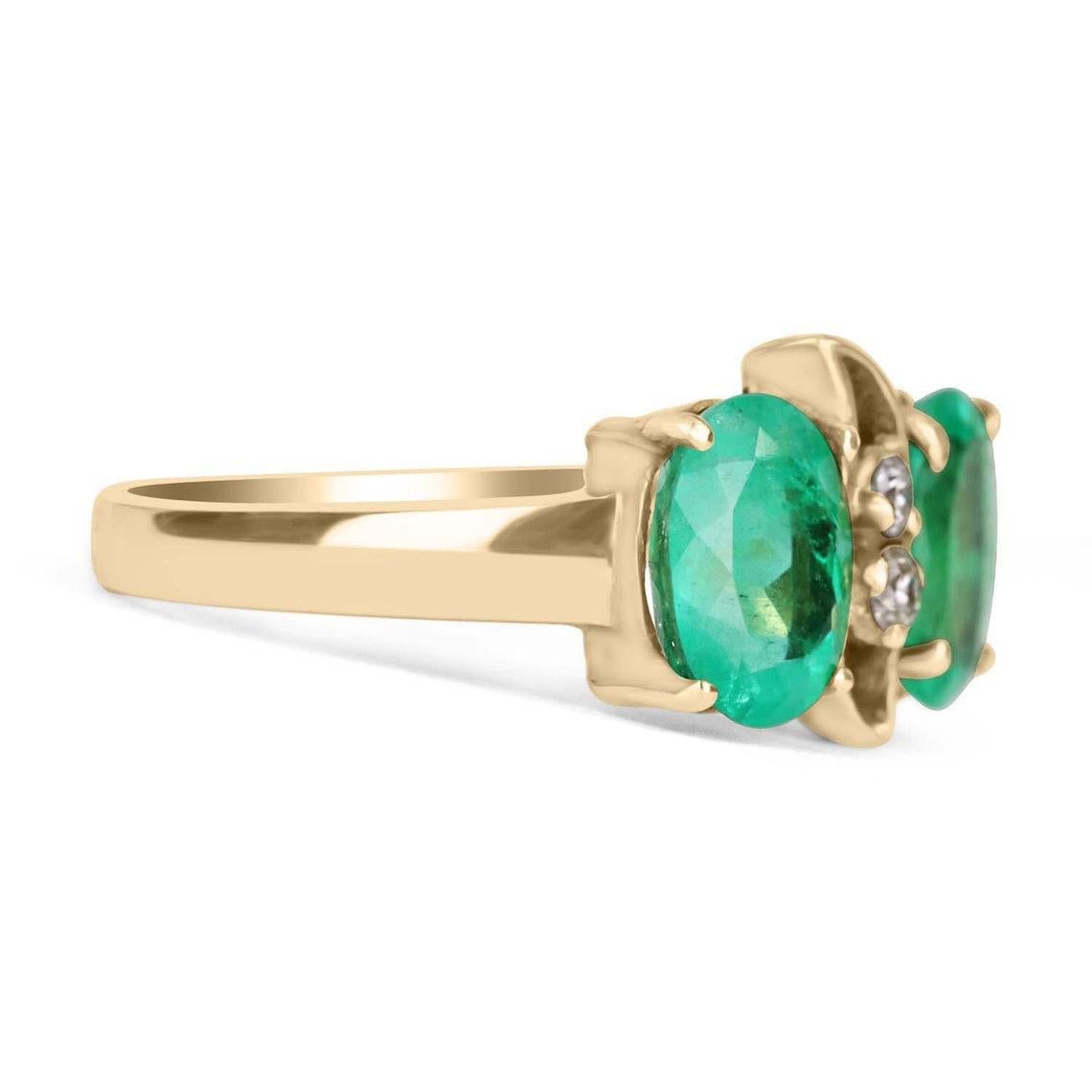 A double oval Colombian emerald & diamond ring in solid 18K yellow gold. Two, medium-green natural emeralds are used in this unique dual setting. The gemstones have the same beautiful color and similar eye clarity. No two emeralds are alike and this