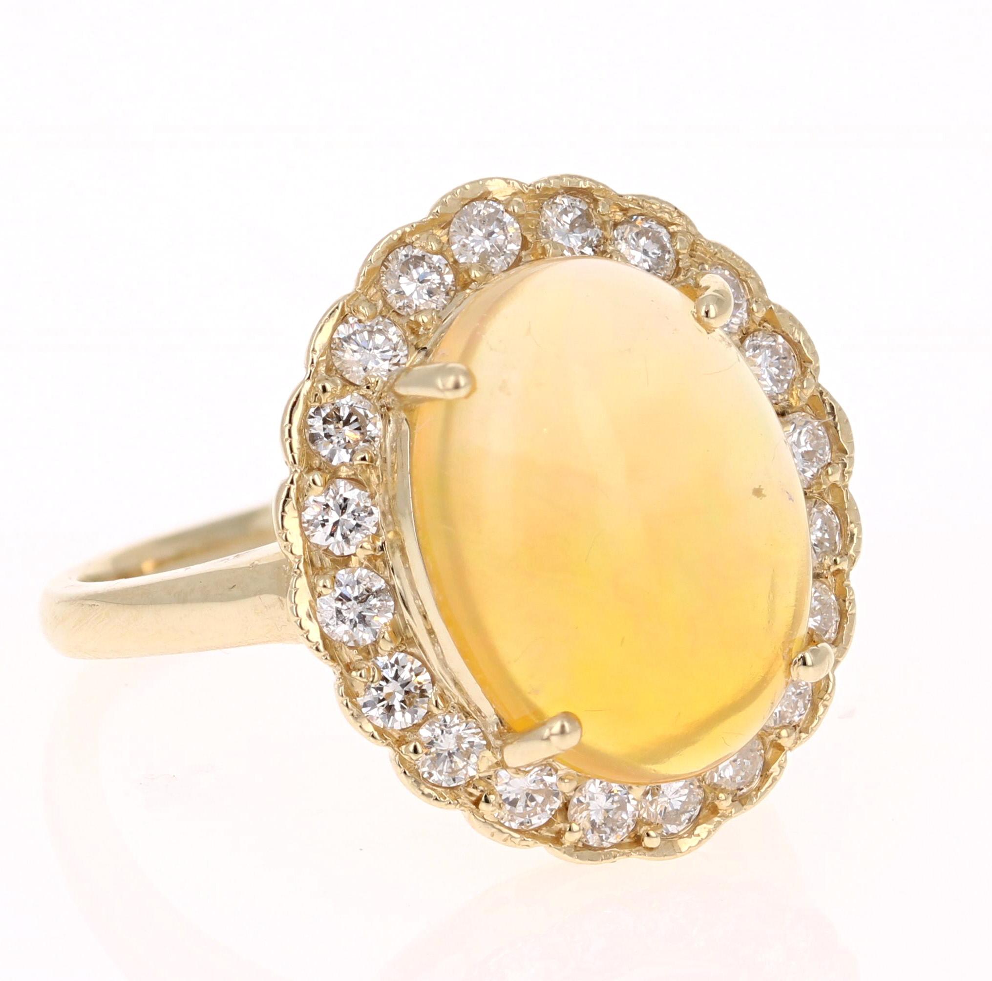 Stunning and extremely opulent 3.61 Carat Oval Cut Opal Diamond Yellow Gold Ring!

The Oval Cut Opal in this Ring weighs 3.24 carats and it is surrounded by 20 Round Cut Diamonds that weigh 0.37 carats.  The total carat weight of this ring is 3.61