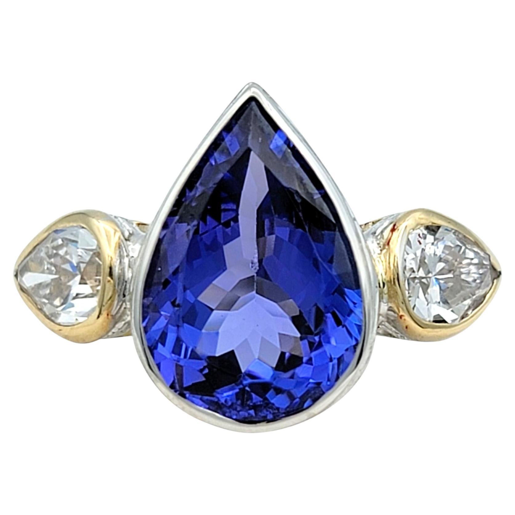 3.61 Carat Pear Cut Tanzanite and Diamond Three-Stone Ring in 18 Karat Gold