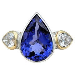 3.61 Carat Pear Cut Tanzanite and Diamond Three-Stone Ring in 18 Karat Gold