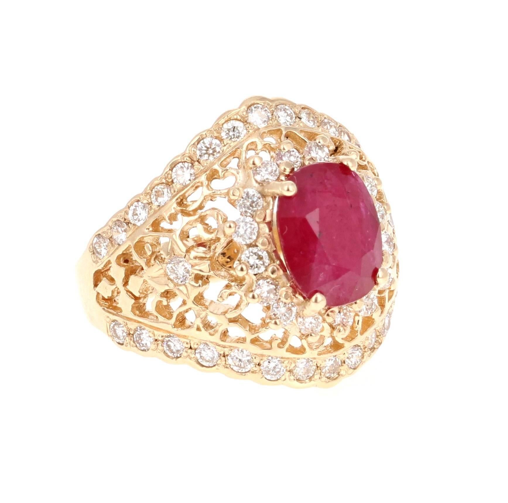 The Oval Cut Ruby is 2.68 carats and is surrounded by 48 Round Cut Diamonds that weigh 0.93 carat (Clarity: VS2, Color: H).  The ring is casted in 14K Yellow Gold and weighs approximately 6.8 grams.  

The ring is a size 7 and can be re-sized at no