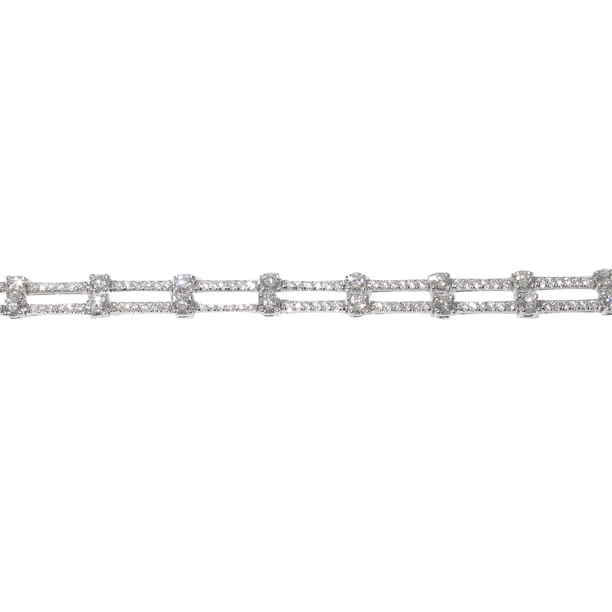 Gorgeous double row diamond bracelet. Each row of diamonds moves independently of the other making this a very special piece. It has a known weight of 3.61 carats of fine white diamonds and is set in 18kt white gold. The shine on this bracelet is