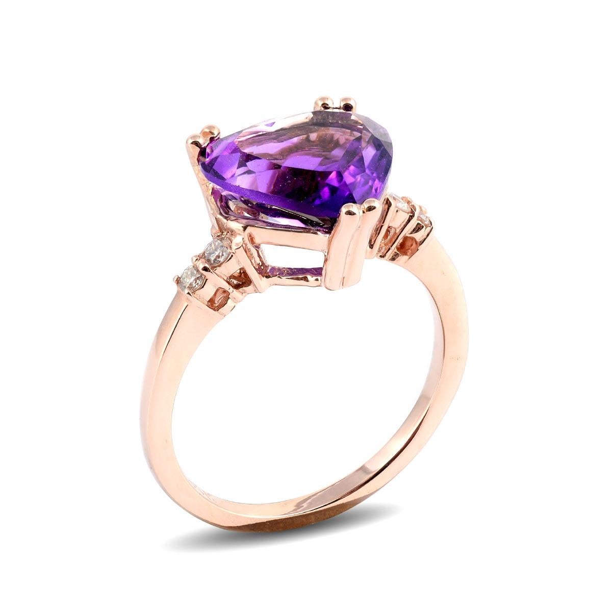 A colorful choice, here is a natural Amethyst that comes set in a 14K rose gold ring. Set with shimmering diamonds on either side, the vivid hues of the purple are brought to life with the fire in the diamonds. A beautiful pair, this ring is a