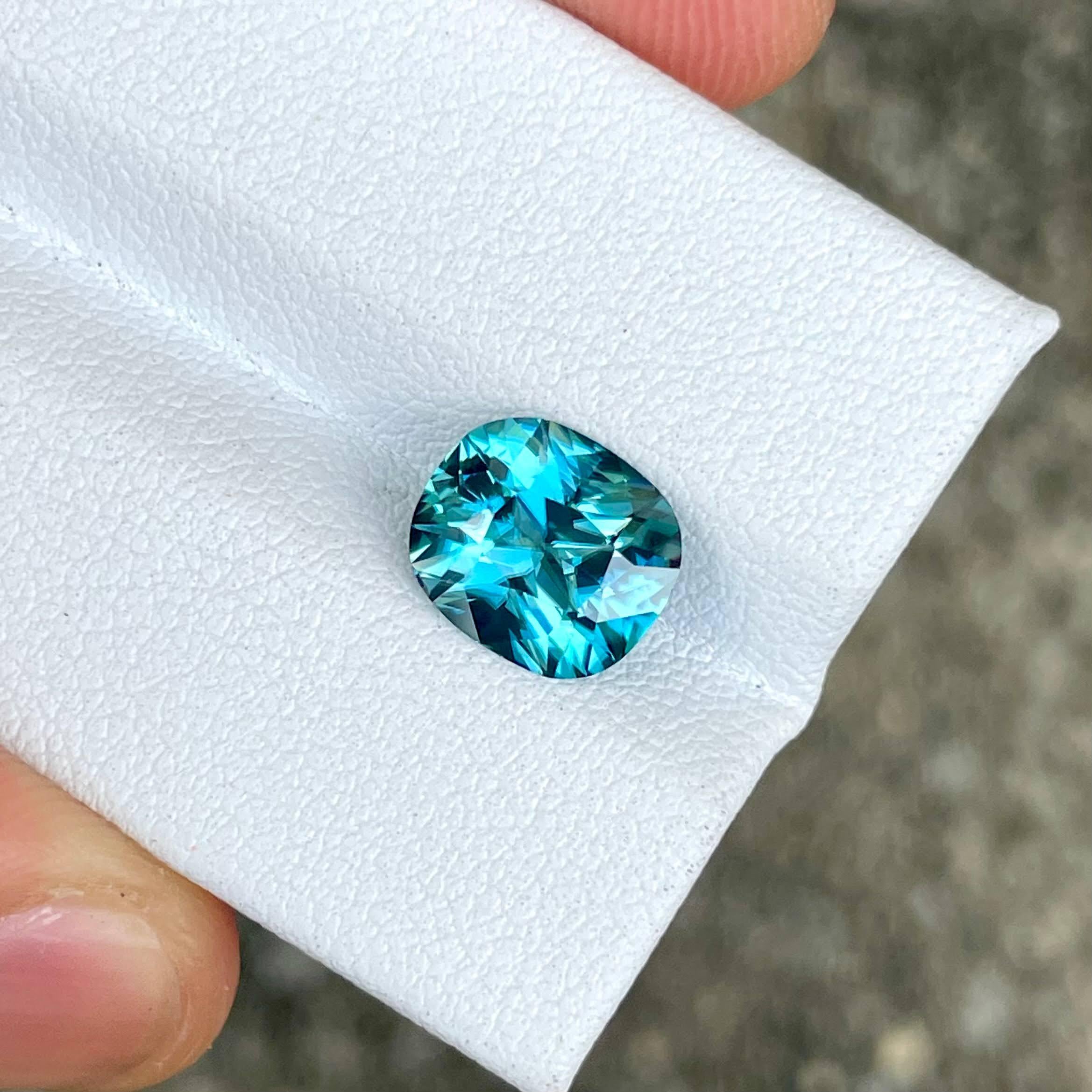 Weight 3.61 carats 
Dimensions 9.25x8.1x5.2 mm
Treatment heated 
Origin Cambodia 
Shape cushion 
Cut fancy cushion 
Clarity VVS 



This exquisite 3.61 carat Blue Zircon gemstone is a stunning example of natural beauty, sourced from the rich lands