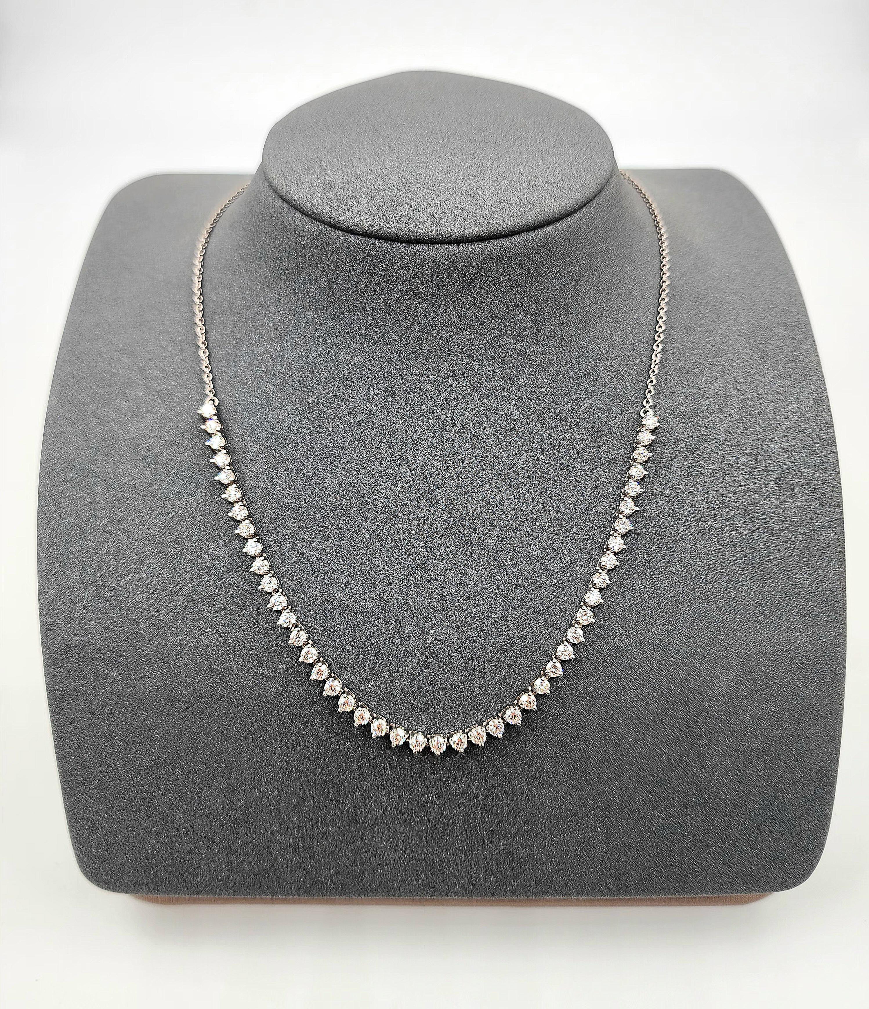 Beautiful tennis necklace with 3-prong set diamonds half-way! You can dress it up or wear it every day! This piece is set in 14k white gold and has 44 Round Brilliant Cut Diamonds weighing 3.61 ct and are graded F-G in color and VS2-SI1 in clarity.

