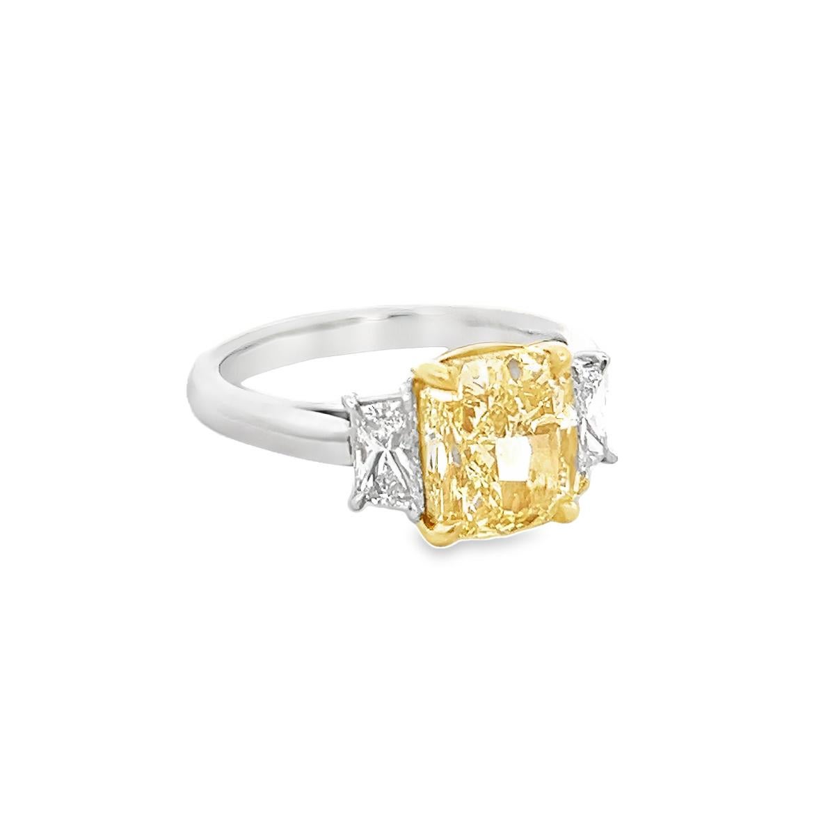 3.61 Total Carat Fancy Yellow Diamond Three-Stone Ladies Engagement Ring. GIA Certified.

Platinum three stone fancy diamond engagement ring crafted with an amazing fancy yellow center diamond. So rare and so beautiful you can often see celebrities