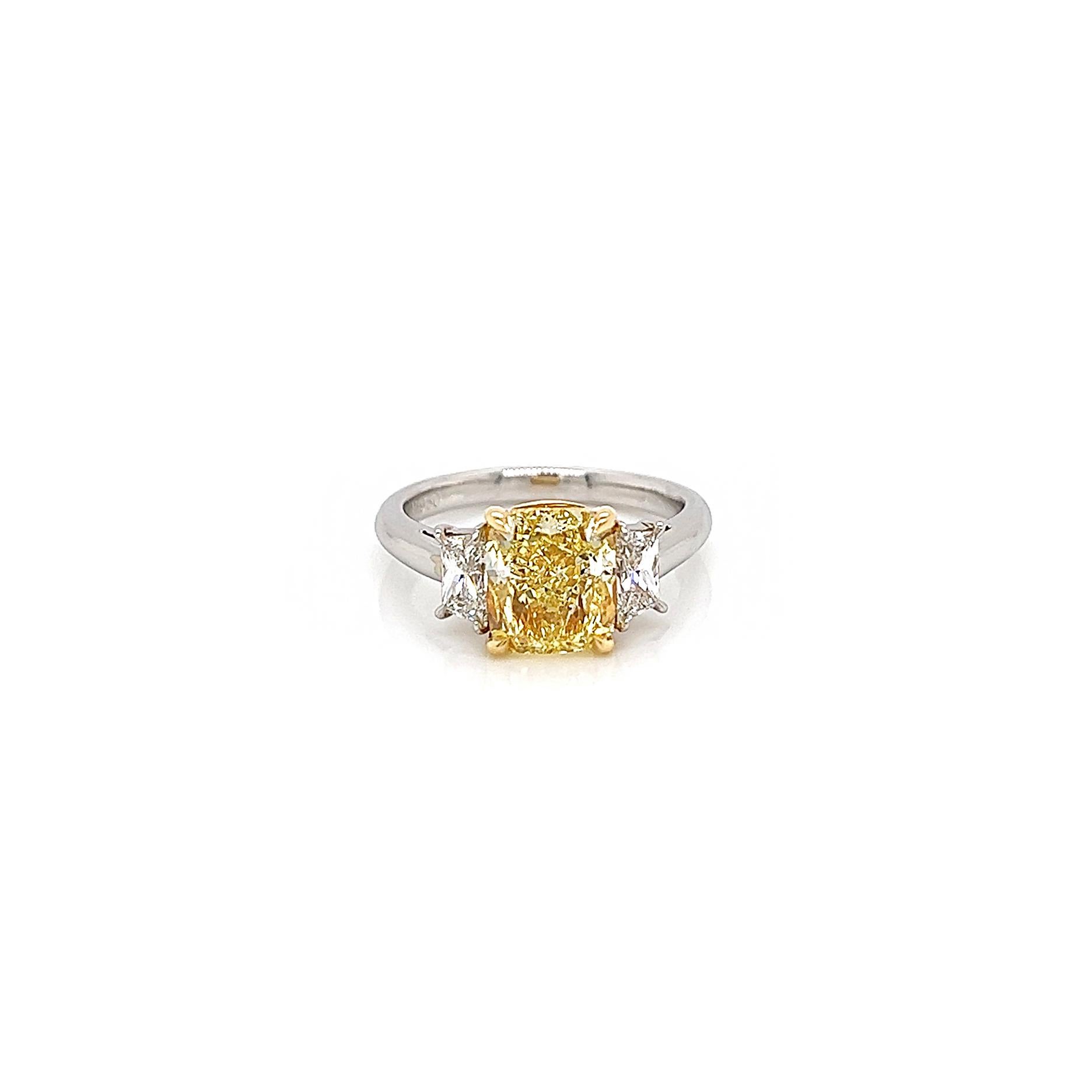 3.61 Total Carat Fancy Yellow Diamond Three-Stone Ladies Engagement Ring. GIA Certified.

Platinum three stone fancy diamond engagement ring crafted with an amazing fancy yellow center diamond. So rare and so beautiful you can often see celebrities