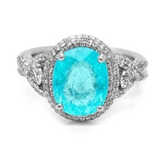 Anillo con turmalina Paraíba de 3,61 ct, de color azul-verde neón intenso y con trazas de cobre, en oro blanco de 18 quilates