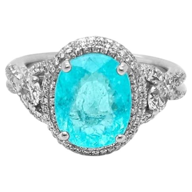 Anillo con turmalina Paraíba de 3,61 ct, de color azul-verde neón intenso y con trazas de cobre, en oro blanco de 18 quilates