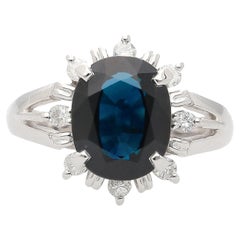 3.62 Carat Oval Blue Sapphire and Diamond Halo Platinum Split Ring
