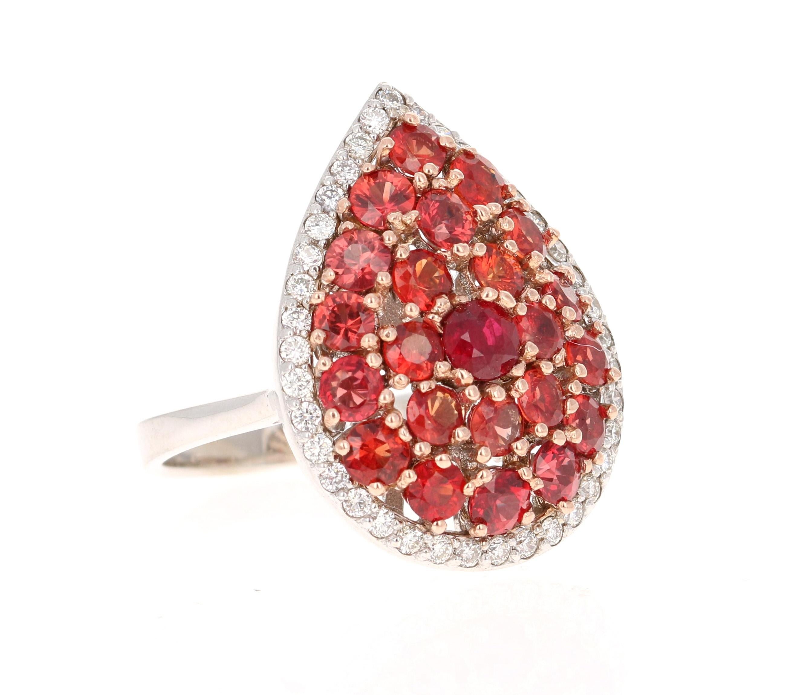 This beautiful ring has Round Cut Natural Red Sapphires that weigh 3.27 Carats. It has a beautiful halo of 38 Round Cut Natural Diamonds that weigh 0.35 Carats. (Clarity: VS, Color: H) 

Curated in 14 Karat White Gold and weighs approximately 8.0