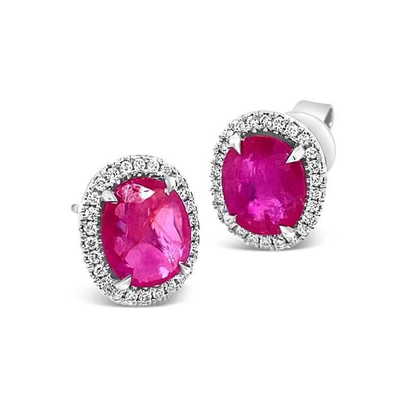 These beautiful earrings feature 3.62 carat total weight in oval Burma, no heat, rubies surrounded by a halo of 0.23 carat total weight in diamonds set in 18 karat white gold. Friction post and butterfly back. 
Measurements: 8.40 x 7.14 x 2.75 mm