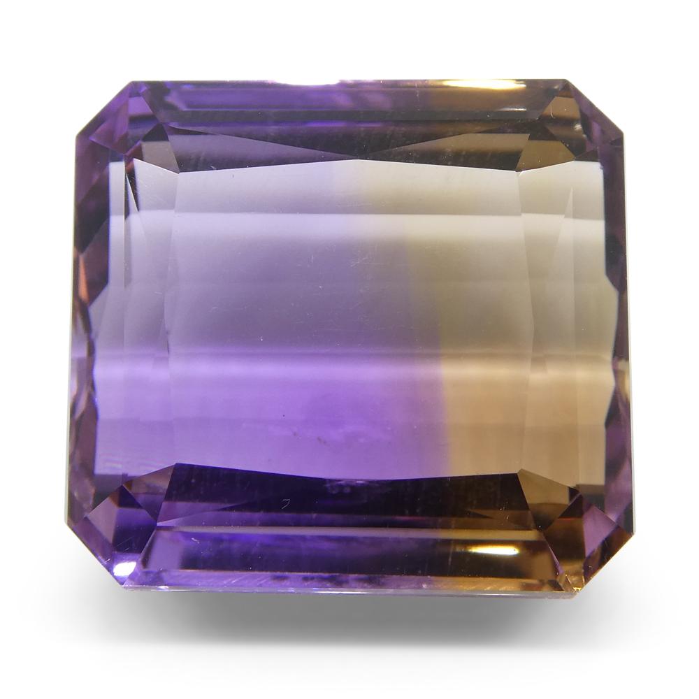 Description:

Gem Type: Ametrine
Number of Stones: 1
Weight: 36.27 cts
Measurements: 19.20x17.80x12 mm
Shape: Square
Cutting Style Crown: Step Cut
Cutting Style Pavilion: Step Cut
Transparency: Transparent
Clarity: Very Slightly Included: Eye Clean