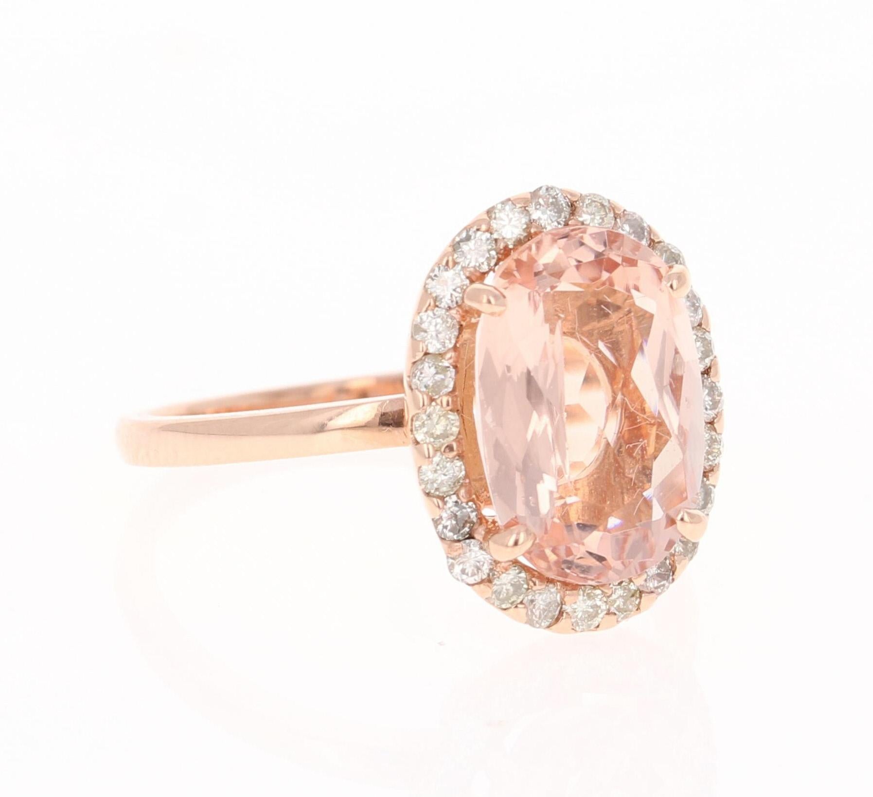 This Morganite ring has a beautiful 3.24 Carat Oval Cut Morganite and is surrounded by a simple halo of  24 Round Cut Diamonds that weigh 0.39 Carats.  The diamonds have a clarity and color of SI-F. The total carat weight of the ring is 3.63 Carats.