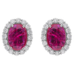 Boucles d
oreilles en or blanc 18 carats avec rubis ovale de 3,63 carats et diamants de 0,85 carat SI/H