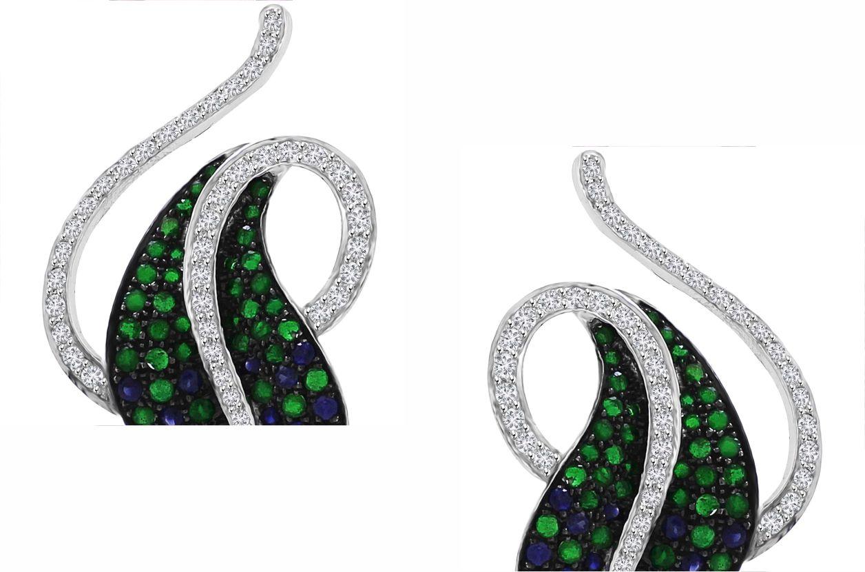 Introducing our exquisite Leaf-Inspired Stud Earrings, a stunning homage to the elegance of nature. These beautiful earrings feature a captivating leaf silhouette, meticulously crafted from vibrant tsavorites and blue sapphires, totaling 3.63